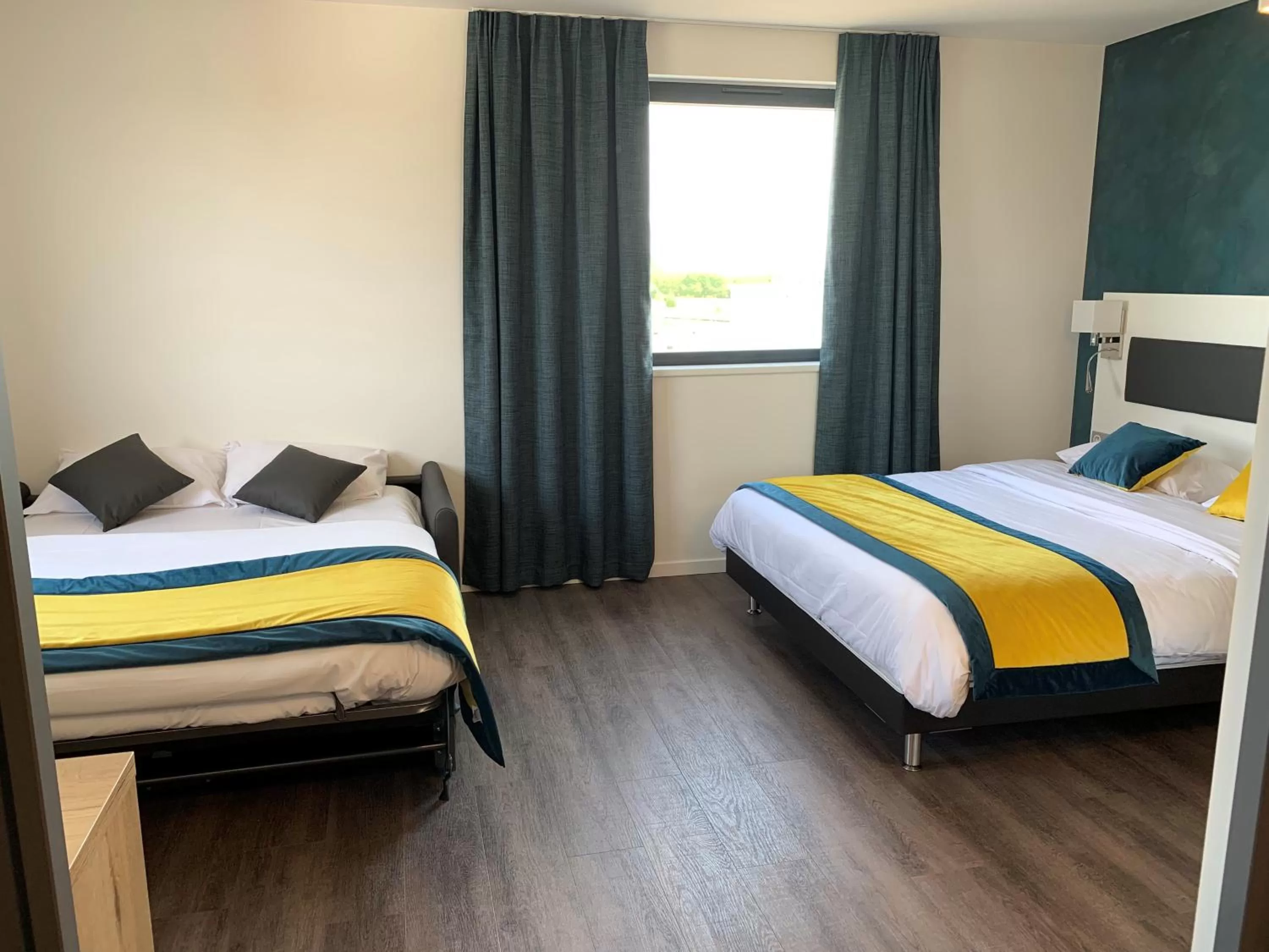 Bed in ATOLON PARK HOTEL