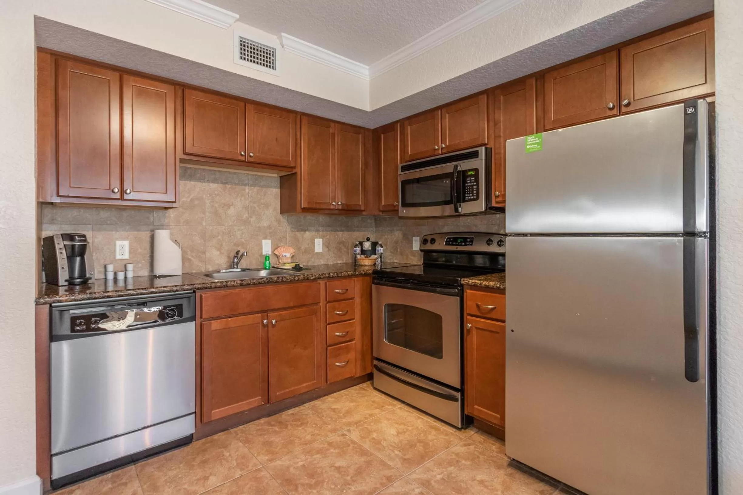 Kitchen or kitchenette, Kitchen/Kitchenette in Coconut Cove All Suite Hotel