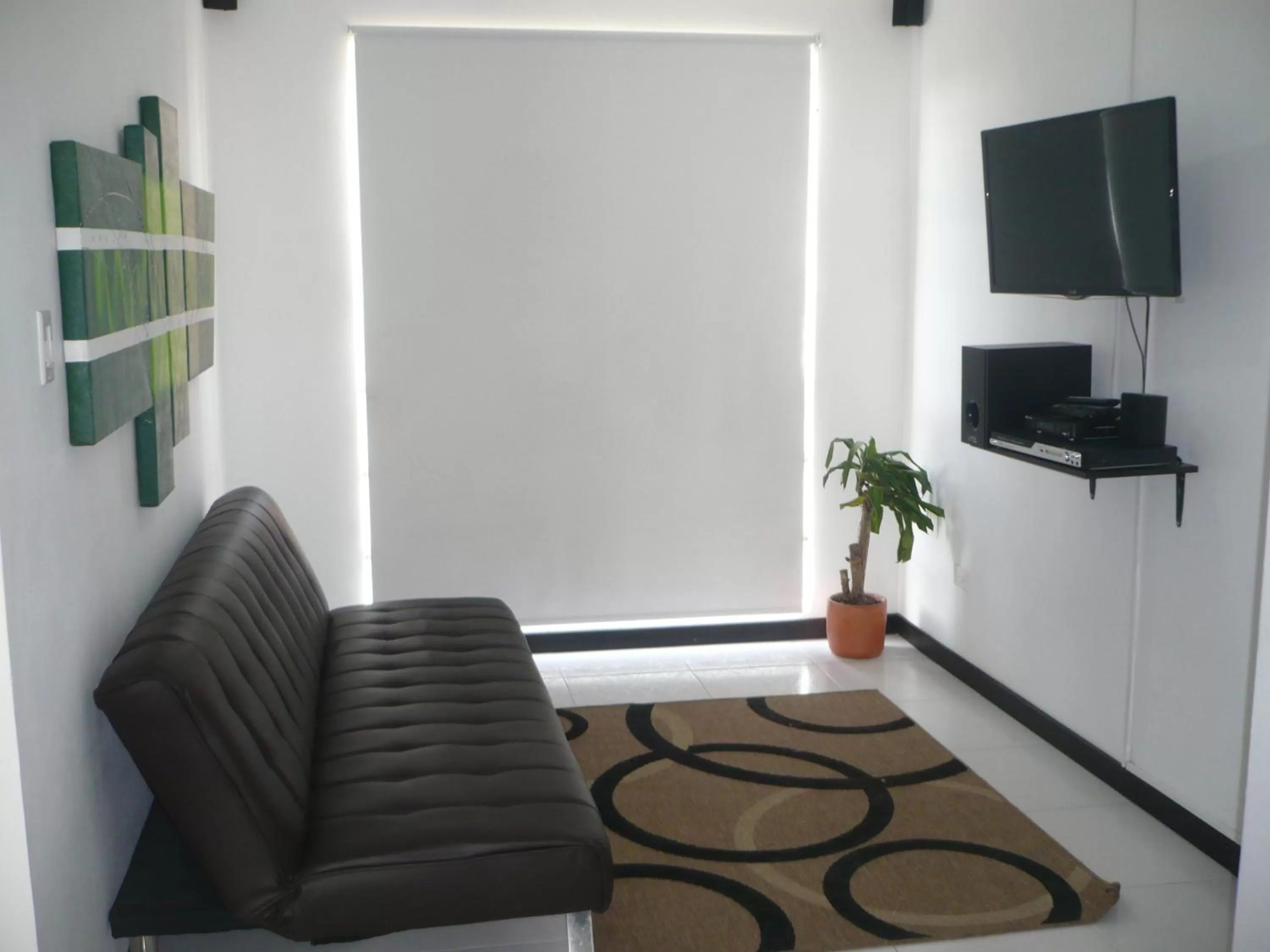 Living room in Apartasuites San Marcos