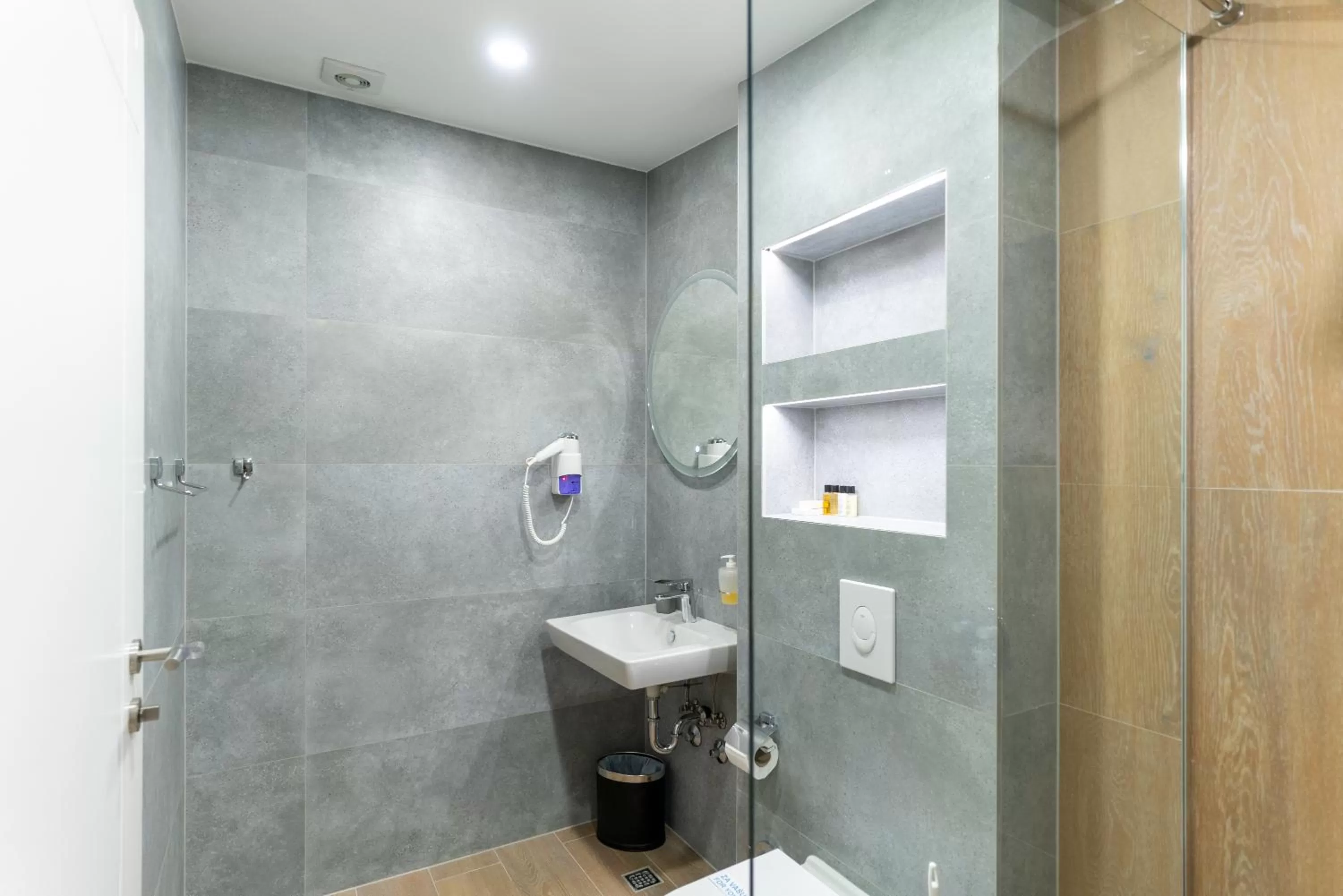 Bathroom in Ornament Hotel and Apartments