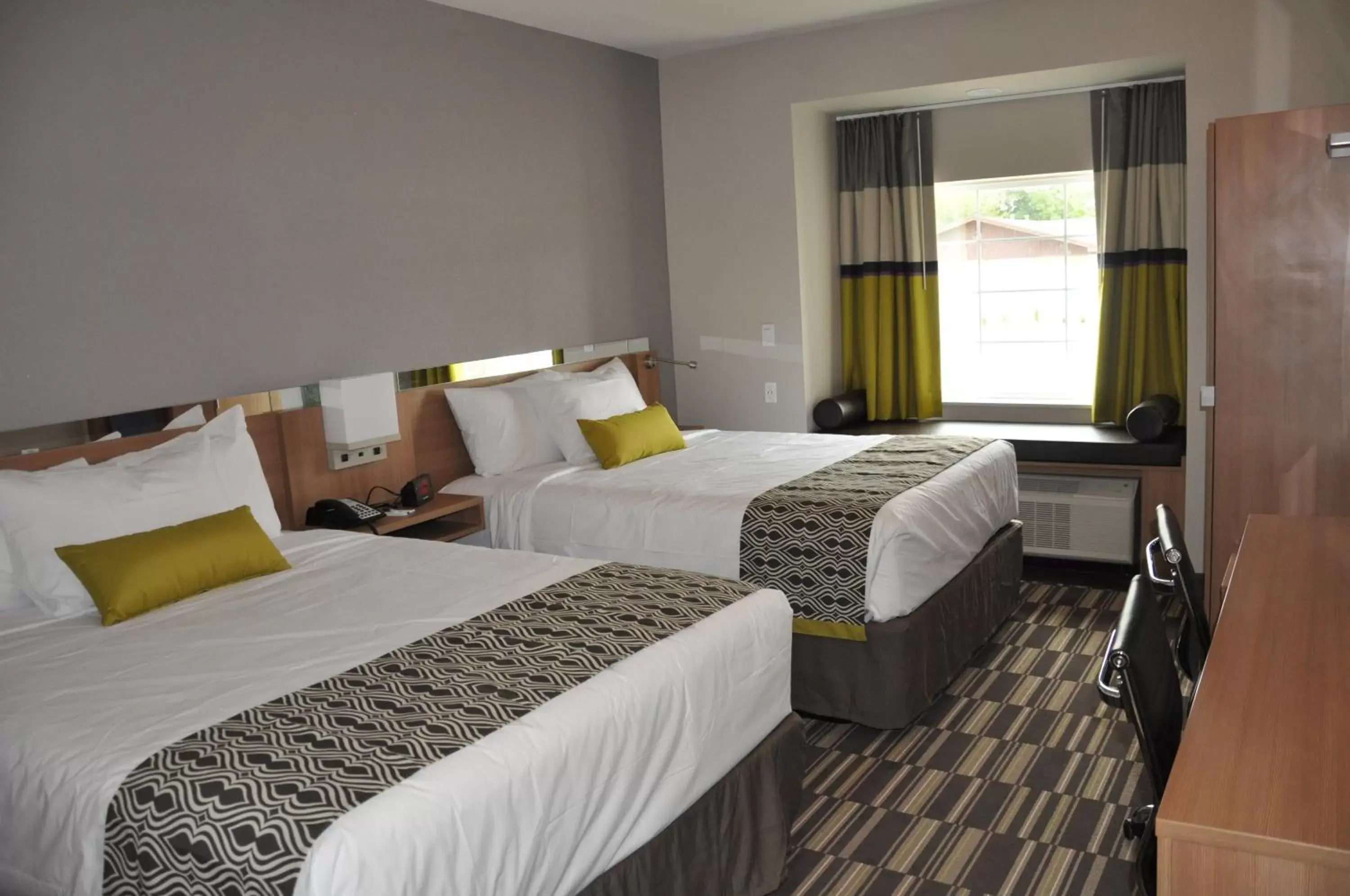 Bed in Microtel Inn & Suites by Wyndham Lubbock