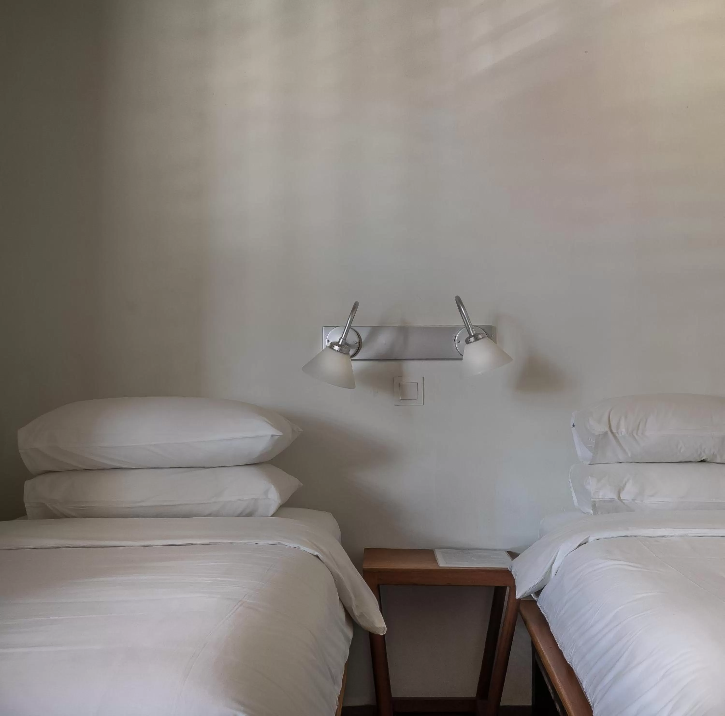 Bed in Ren I Tang Heritage Inn