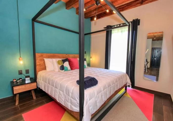 Bed in Antigua Trece Hotel Fusión