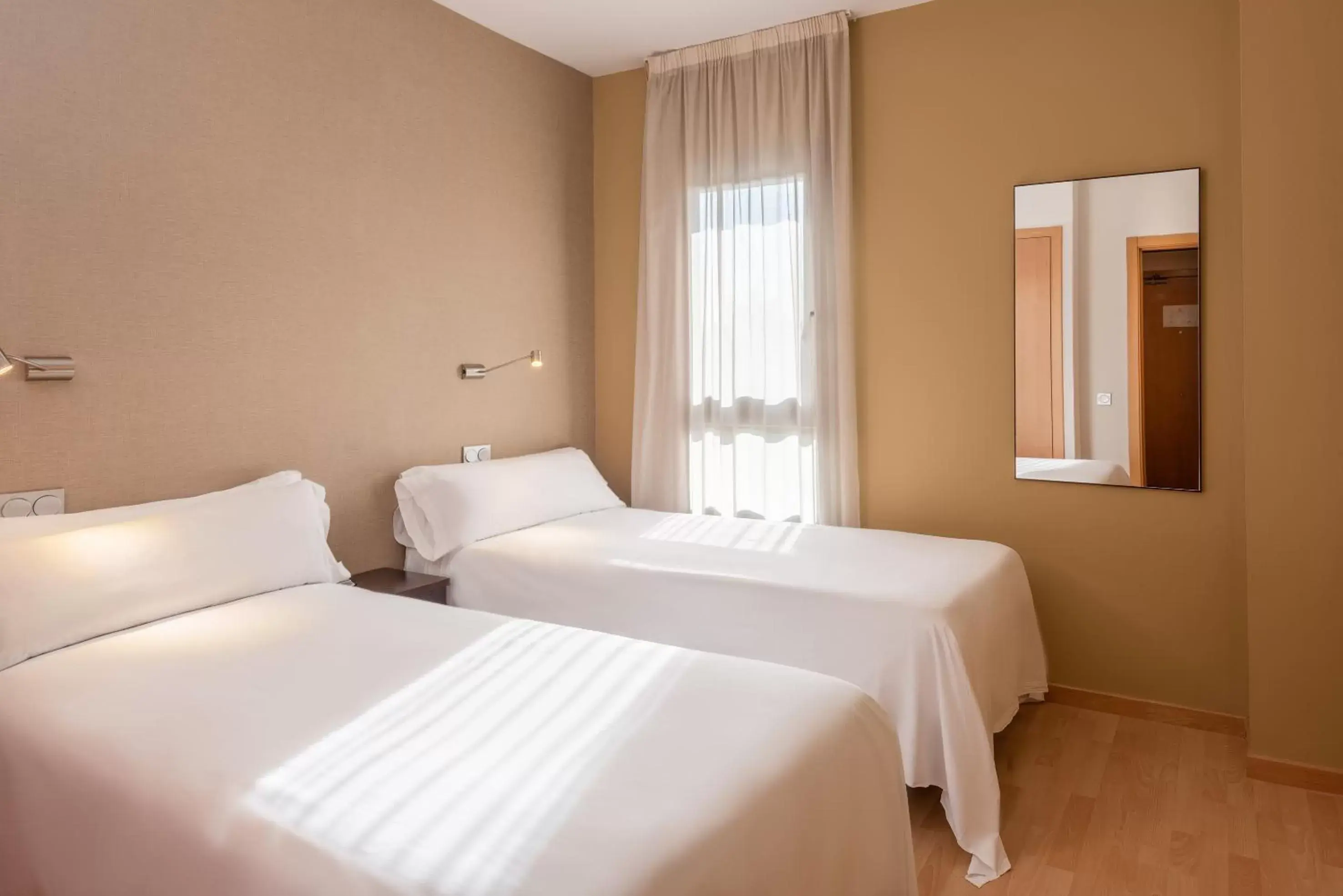 Bed in Madrid Airport Suites, Affiliated by Meliá