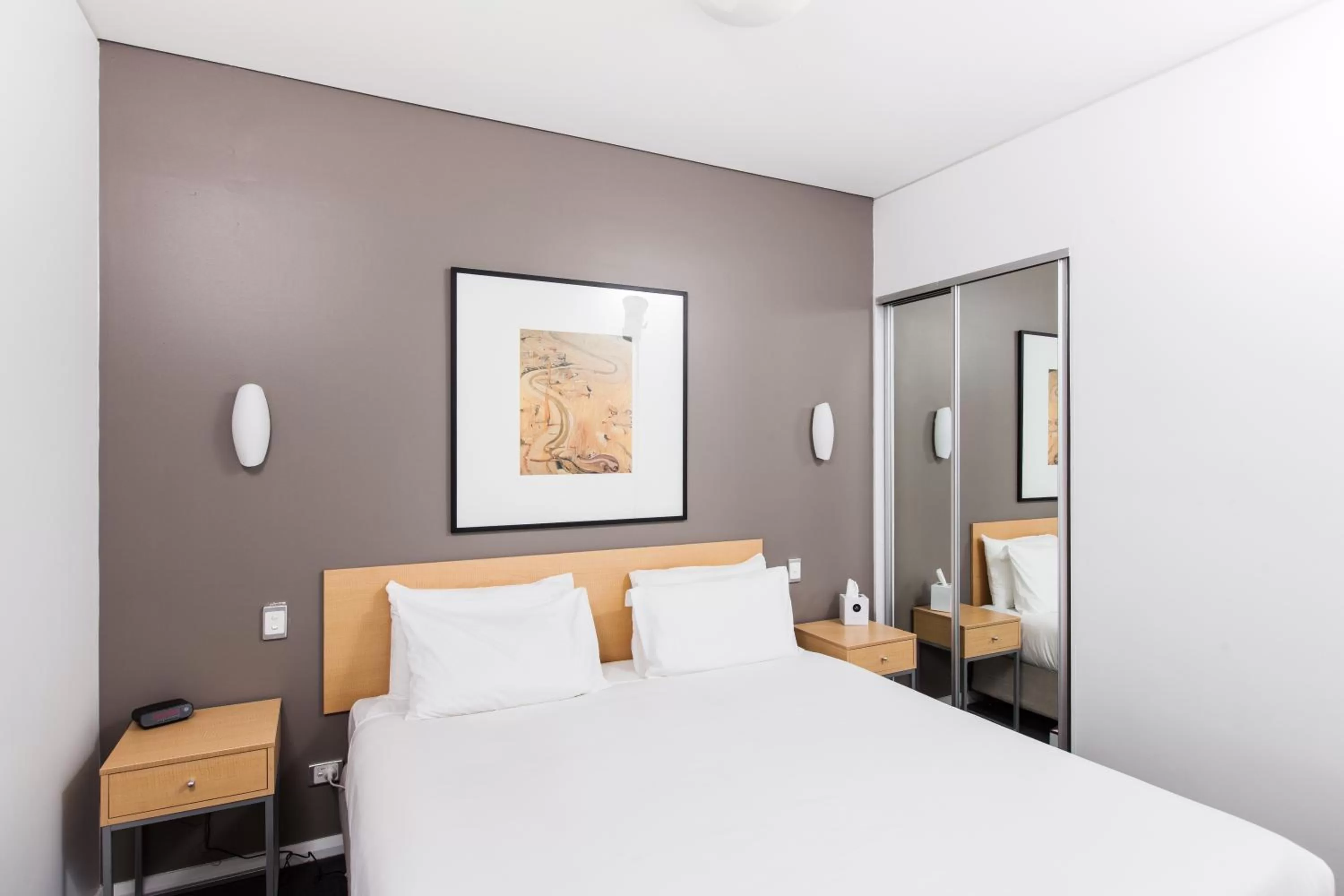 Bed in Majestic Oasis Apartments