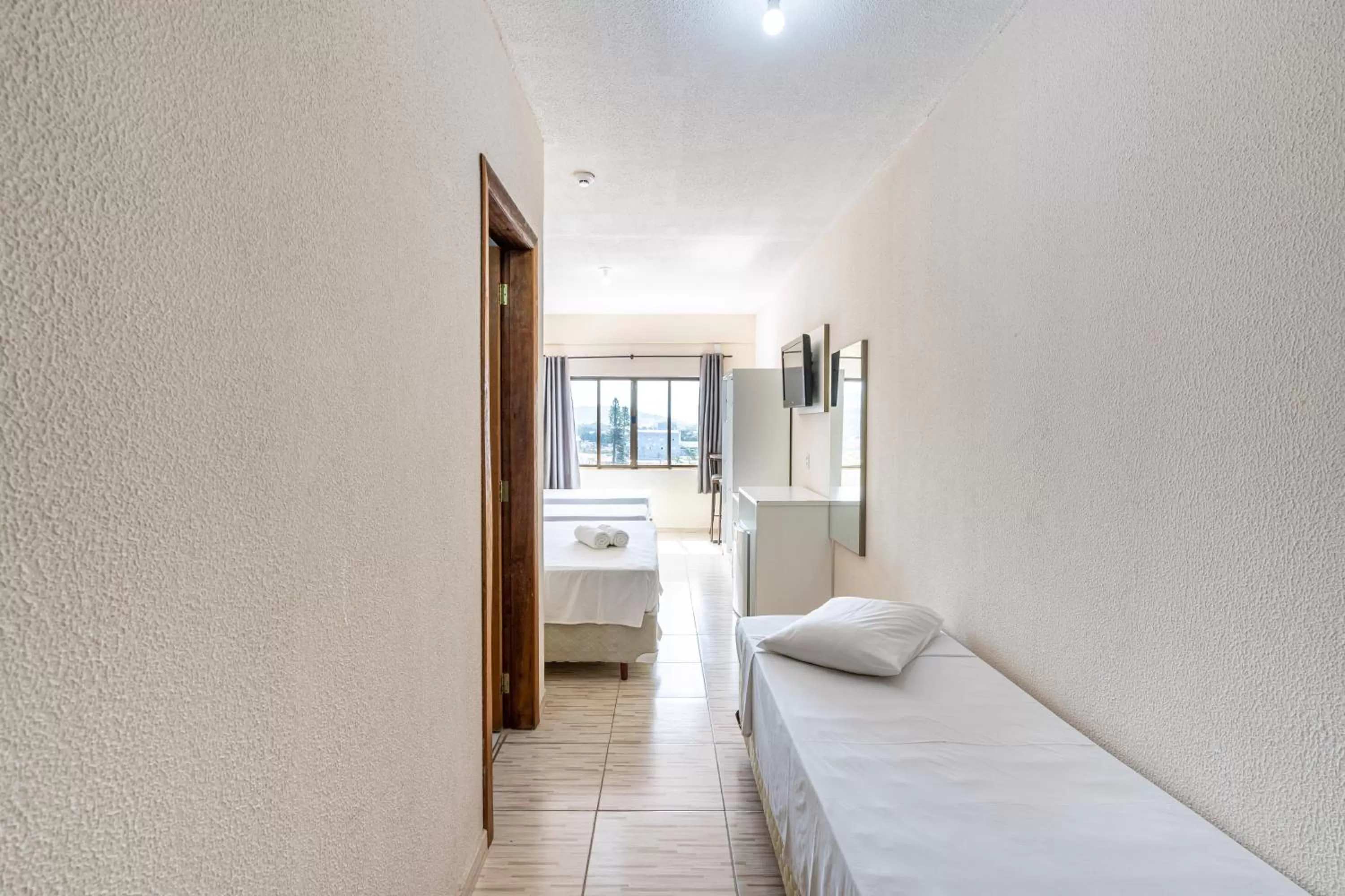 Bed in Hotel Conexão