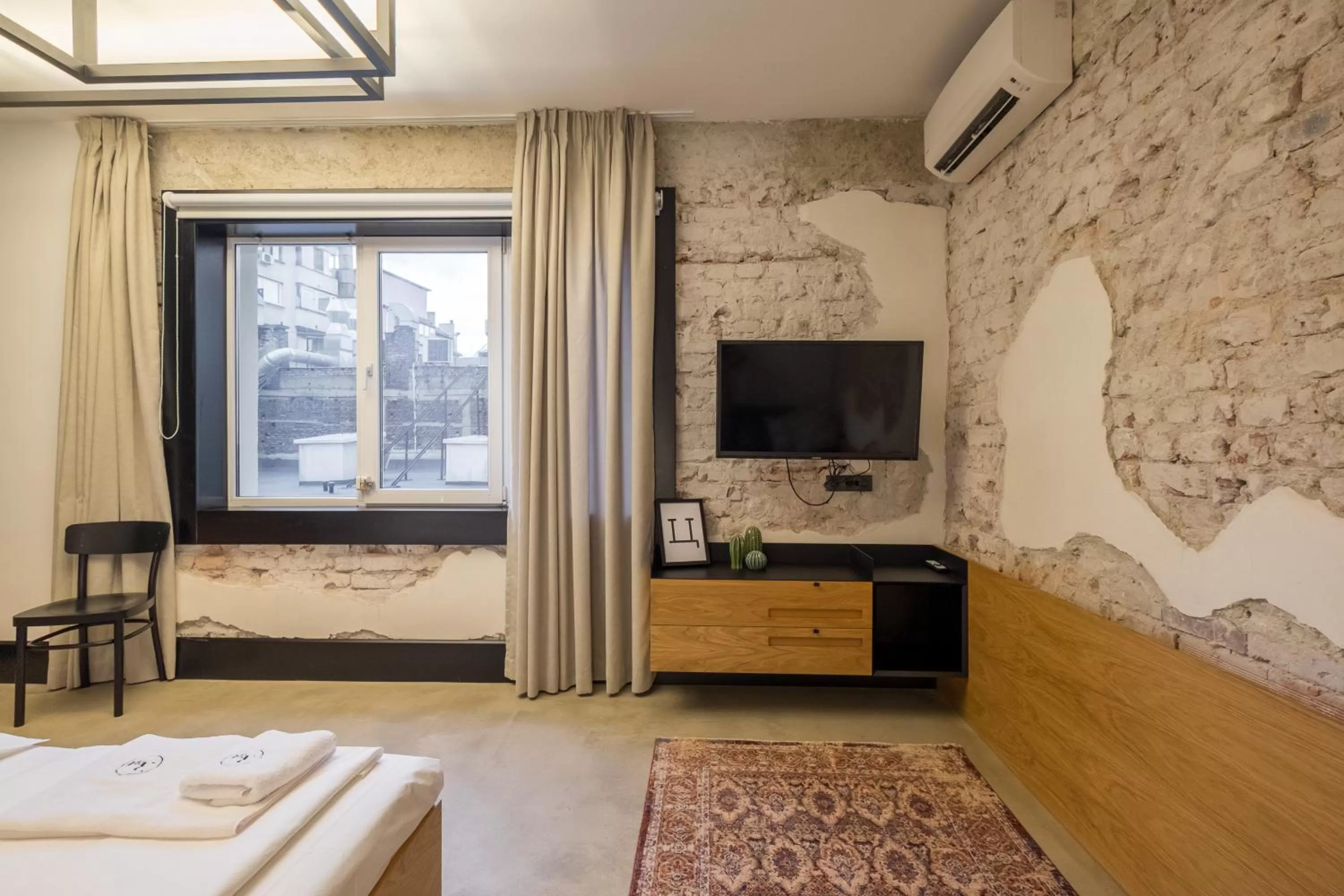 Bed in R34 Boutique Hotel