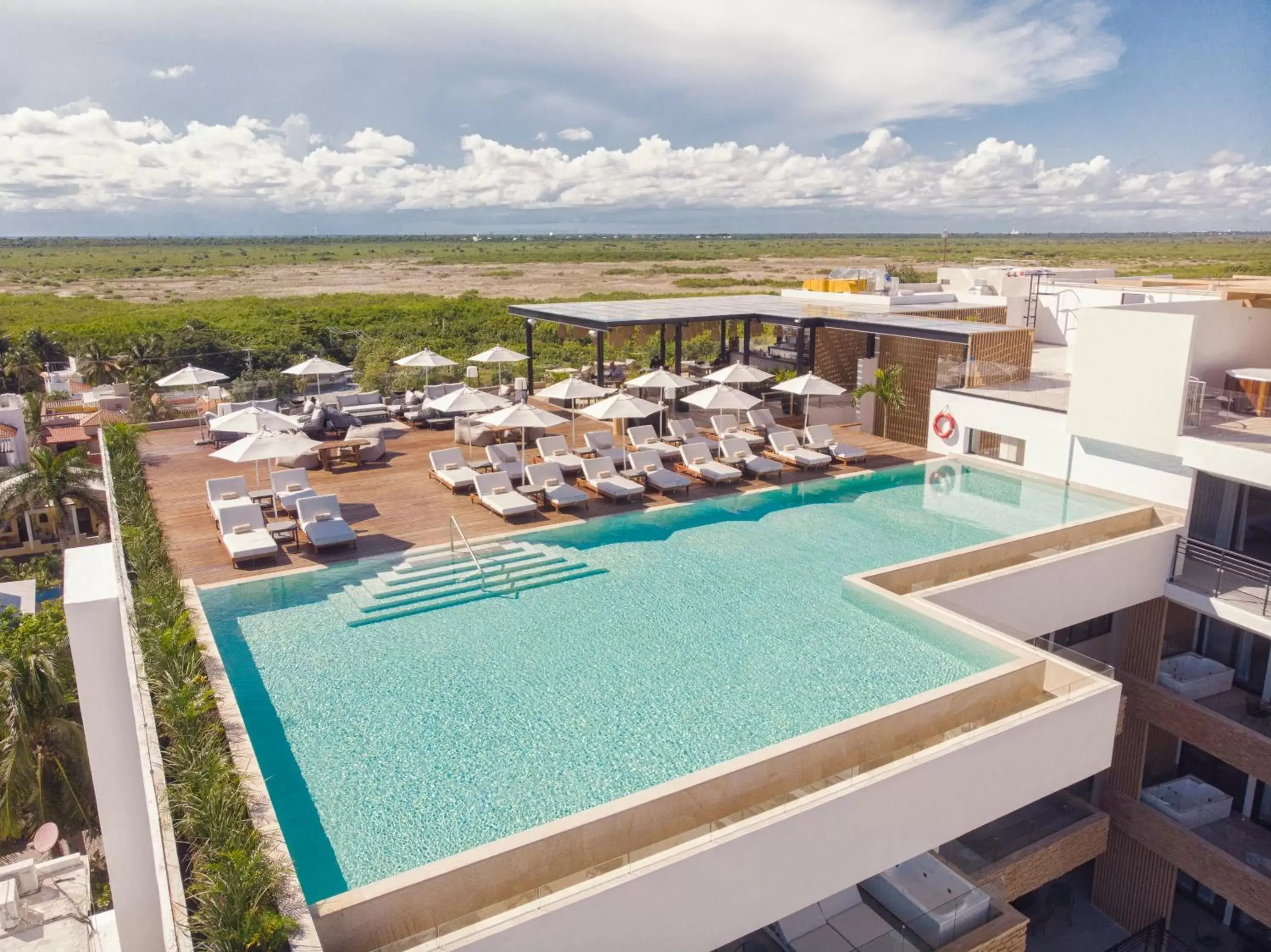 Lounge or bar, Pool View in The Fives Oceanfront