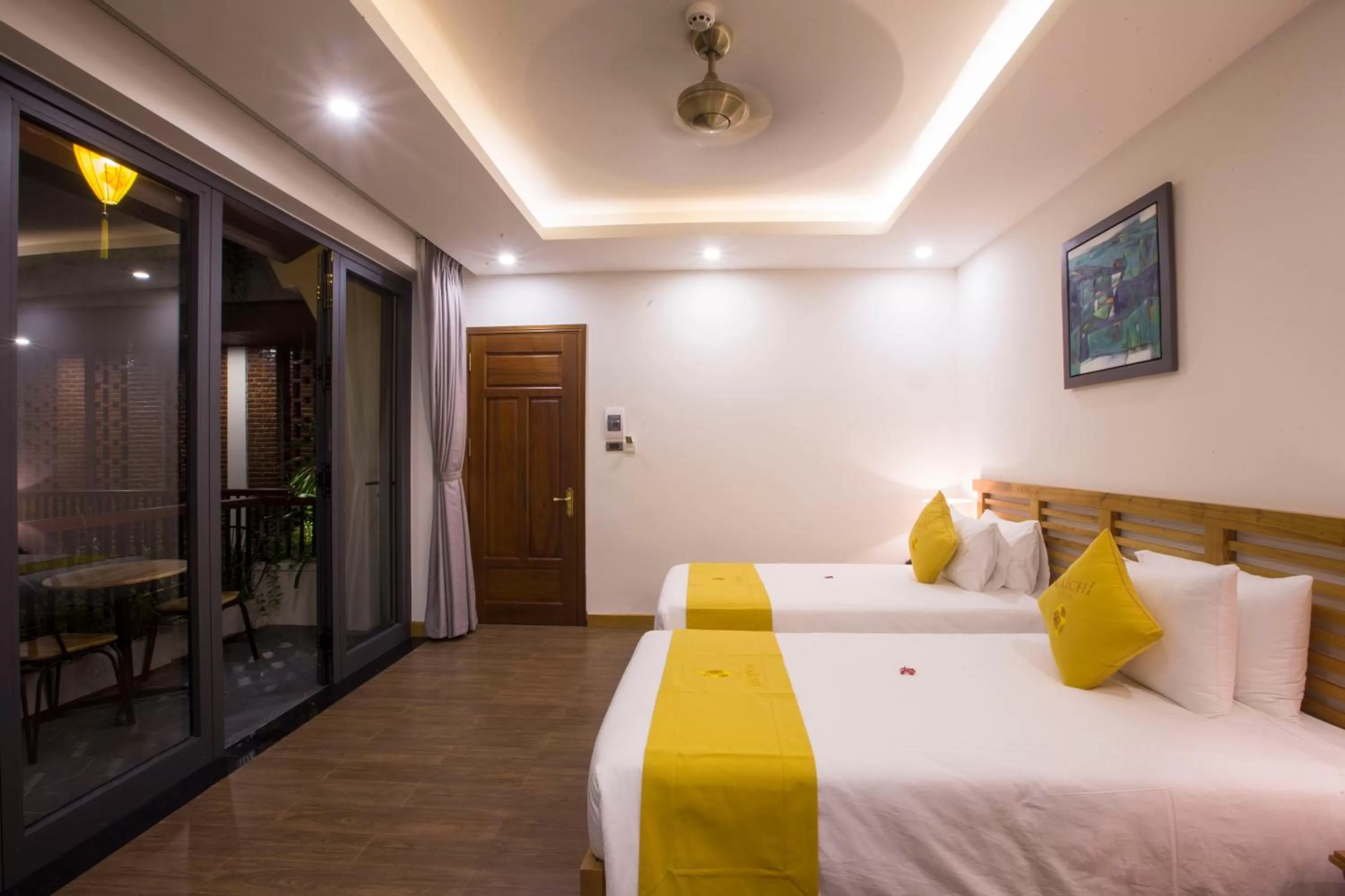 Photo of the whole room, Bed in MaiChi Villa Hoi An