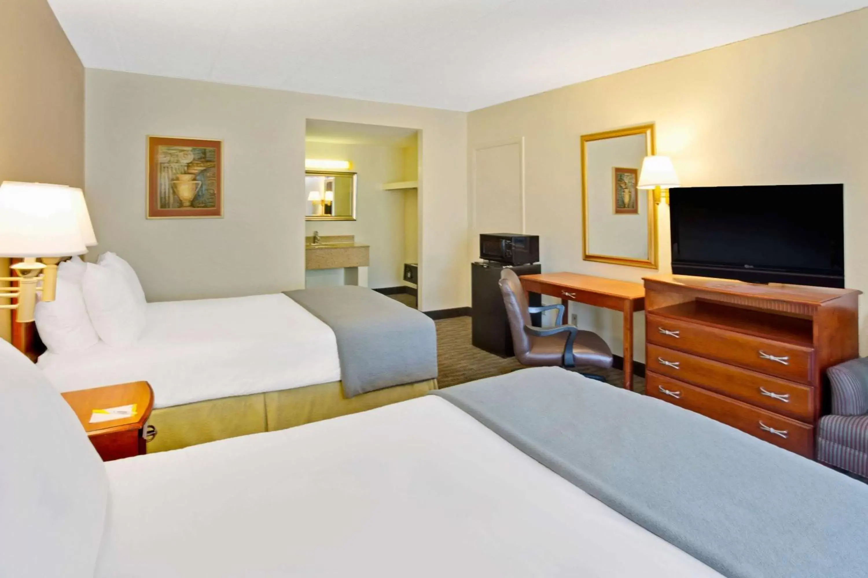 Photo of the whole room, Bed in Days Inn by Wyndham Silver Spring