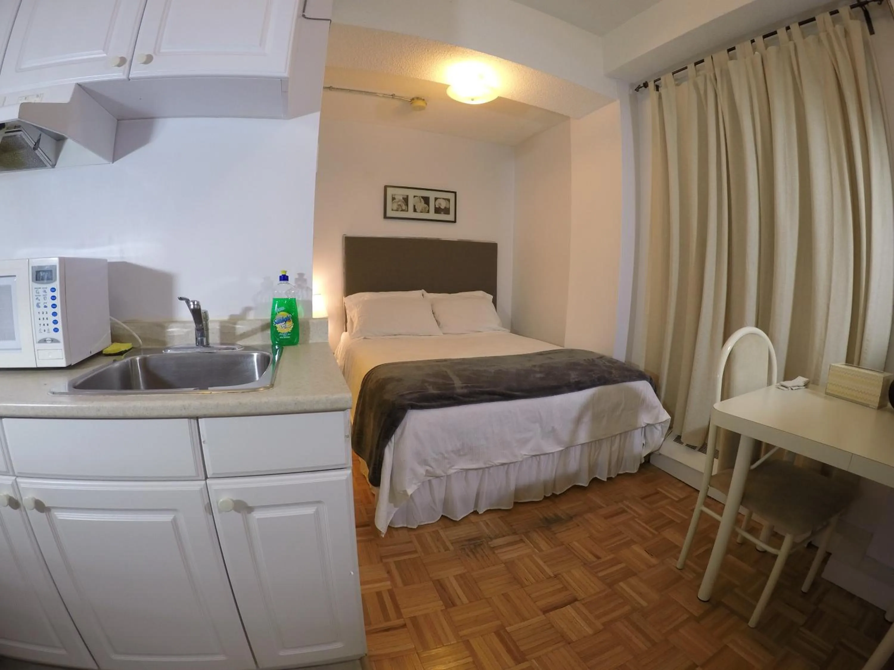 Photo of the whole room, Bed in Saint Lawrence Residences and Suites