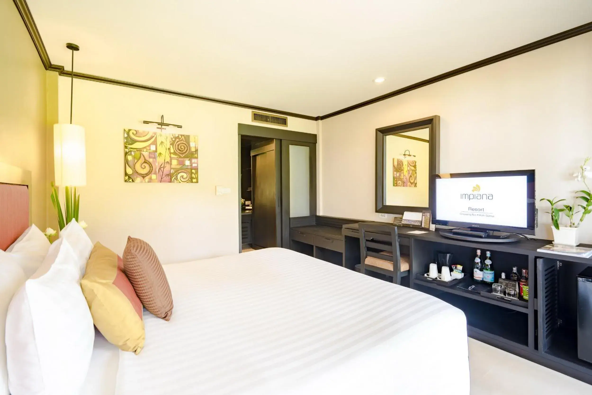 Bed, TV/Entertainment Center in Impiana Beach Front Resort Chaweng Noi, Koh Samui