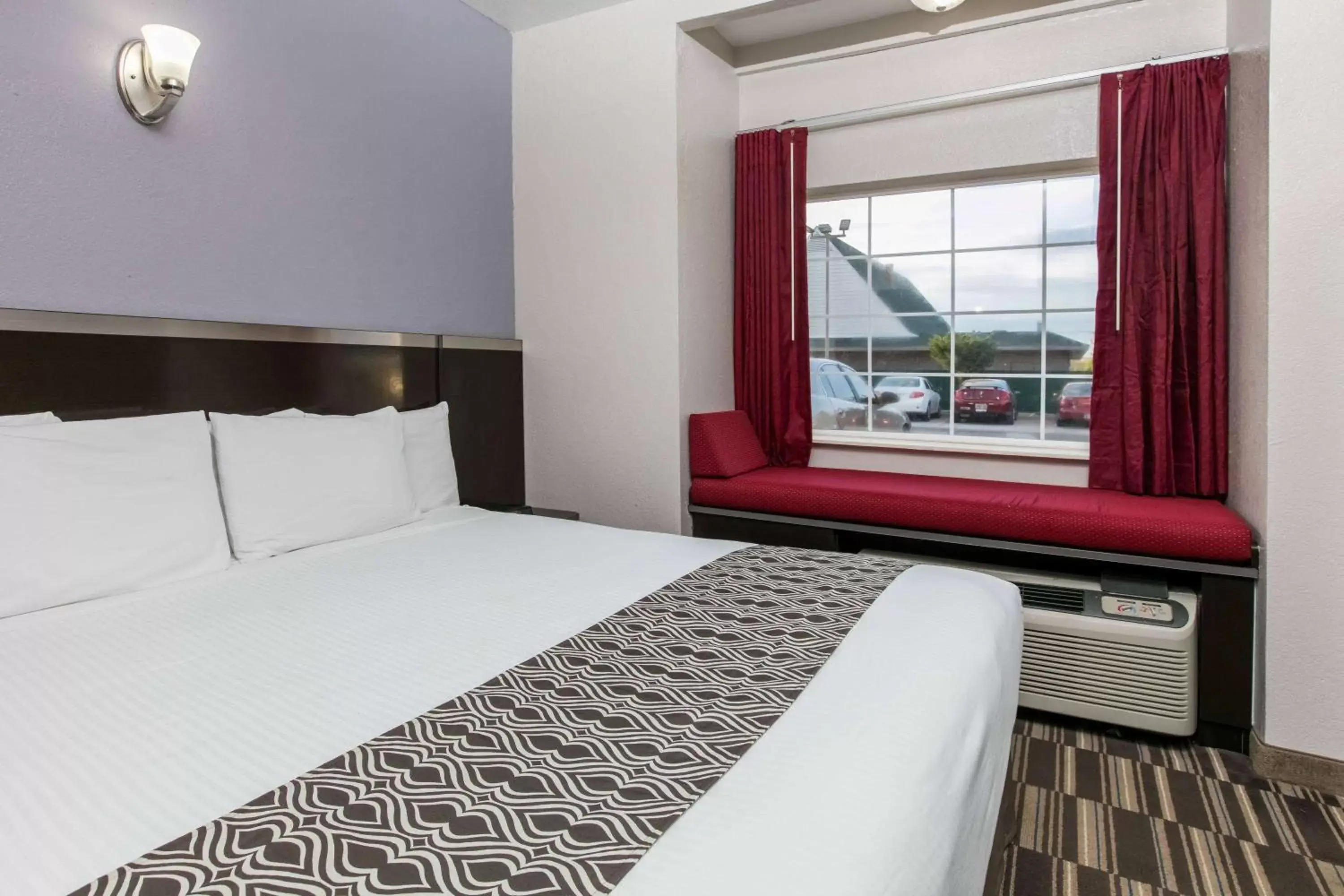 Bed in Microtel Inn & Suites by Wyndham Oklahoma City Airport