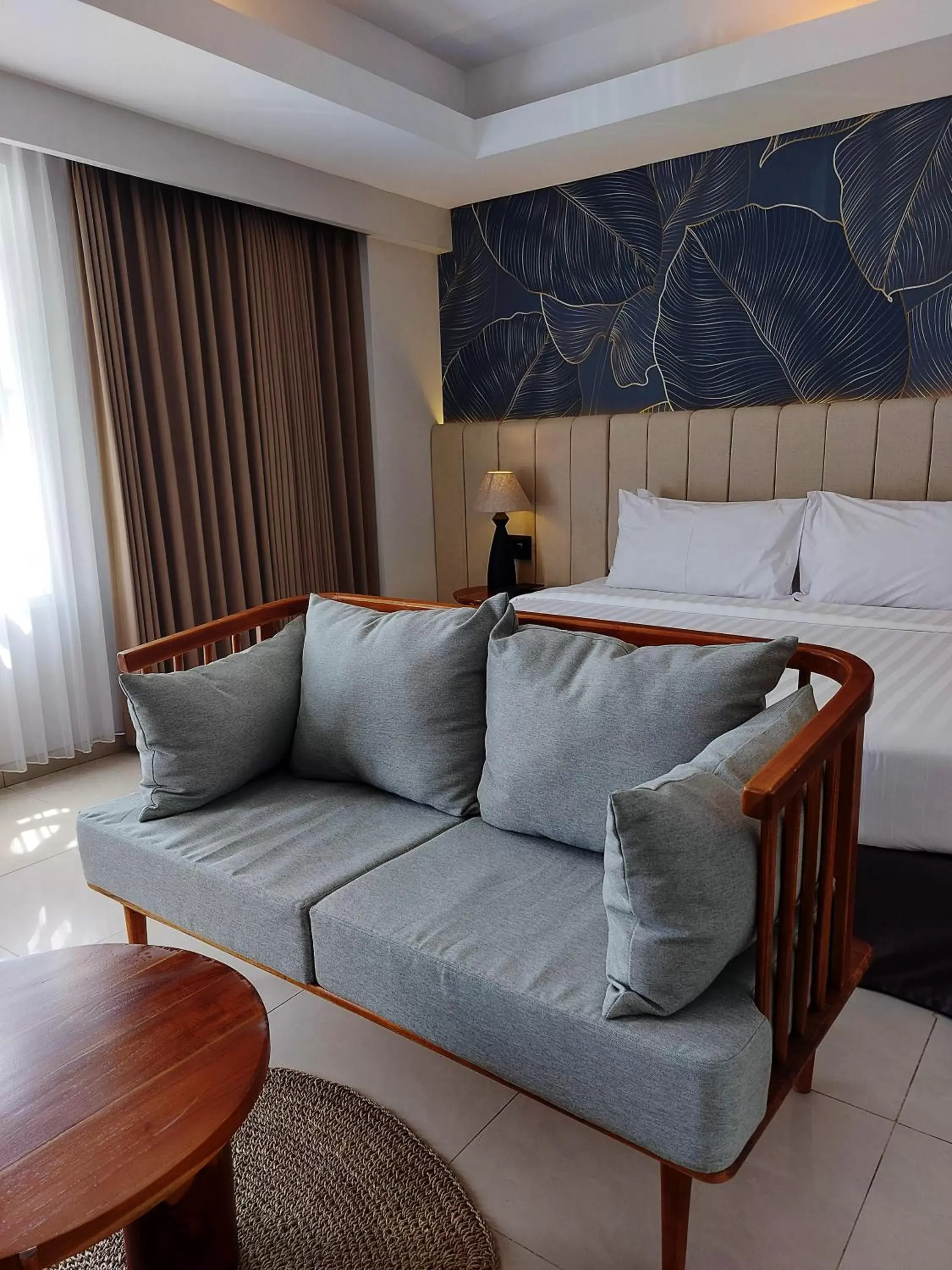 Bed, Seating Area in Crystalkuta Hotel - Bali