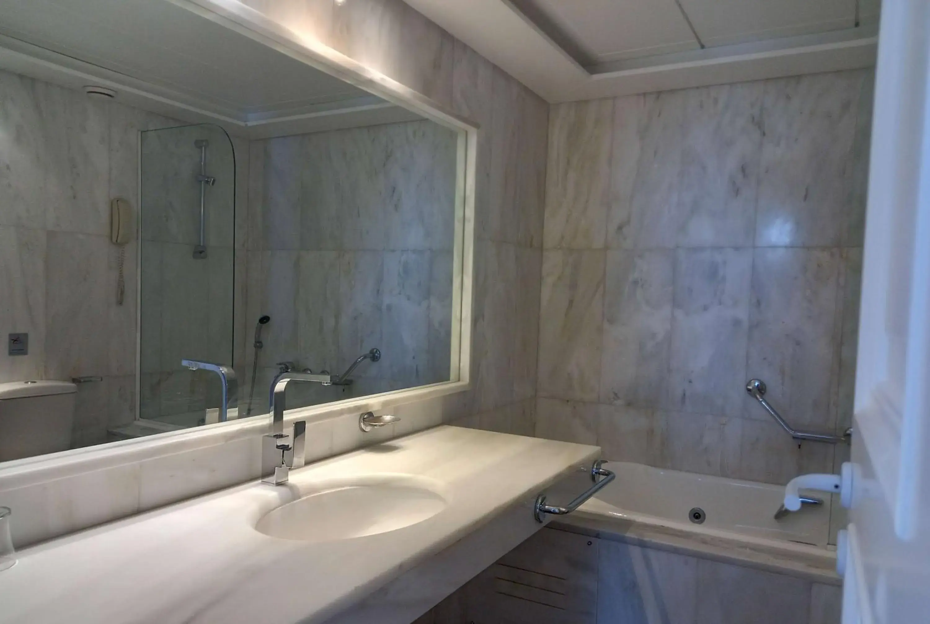 Bathroom in Ramada Loutraki Poseidon Resort Bathroom in Ramada Loutraki Poseidon Resort
