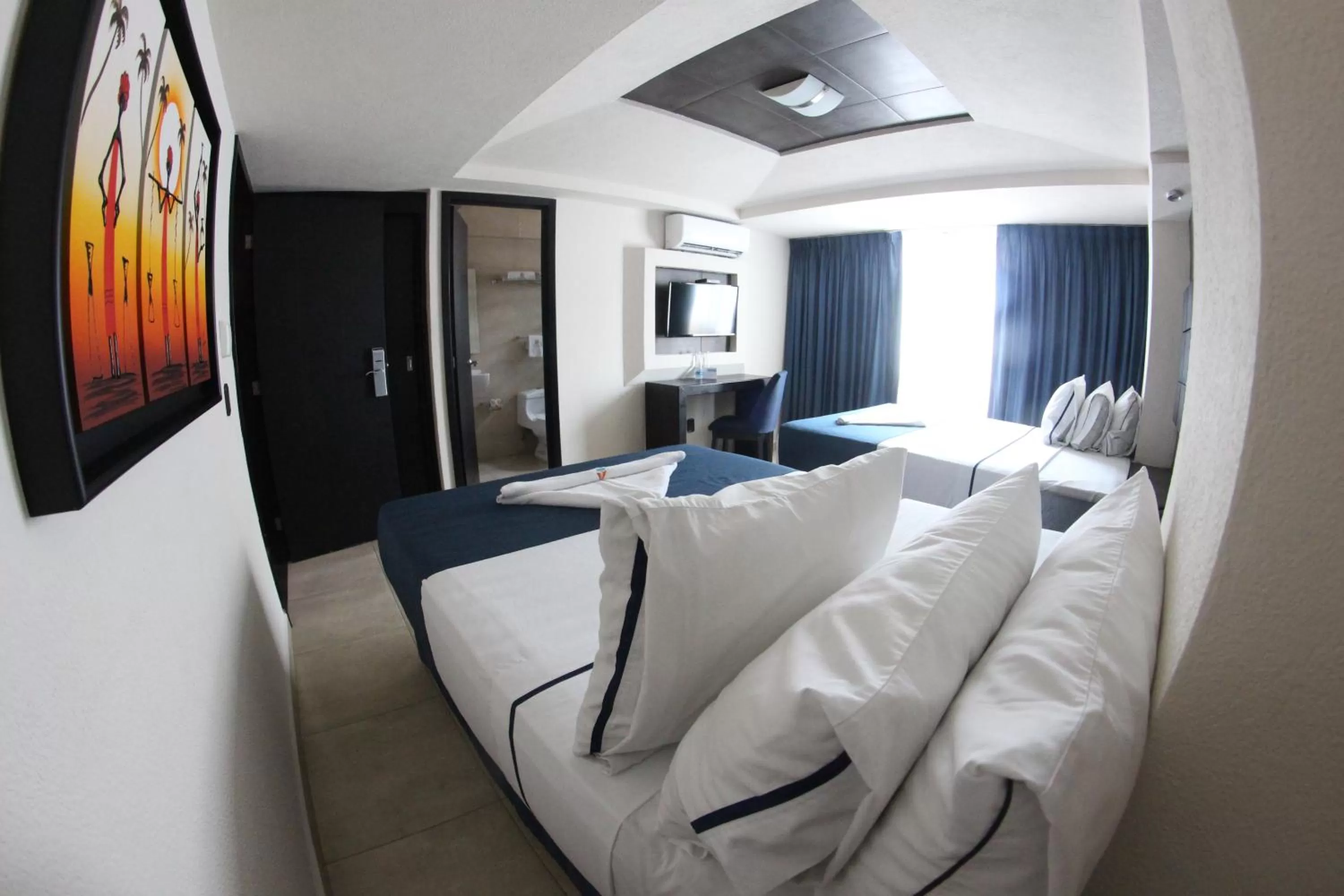 Photo of the whole room, Bed in Hotel Portonovo Plaza Malecon