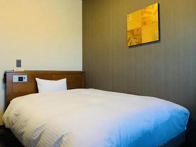 Bed in Hotel Route-Inn Sendaiko Kita Inter