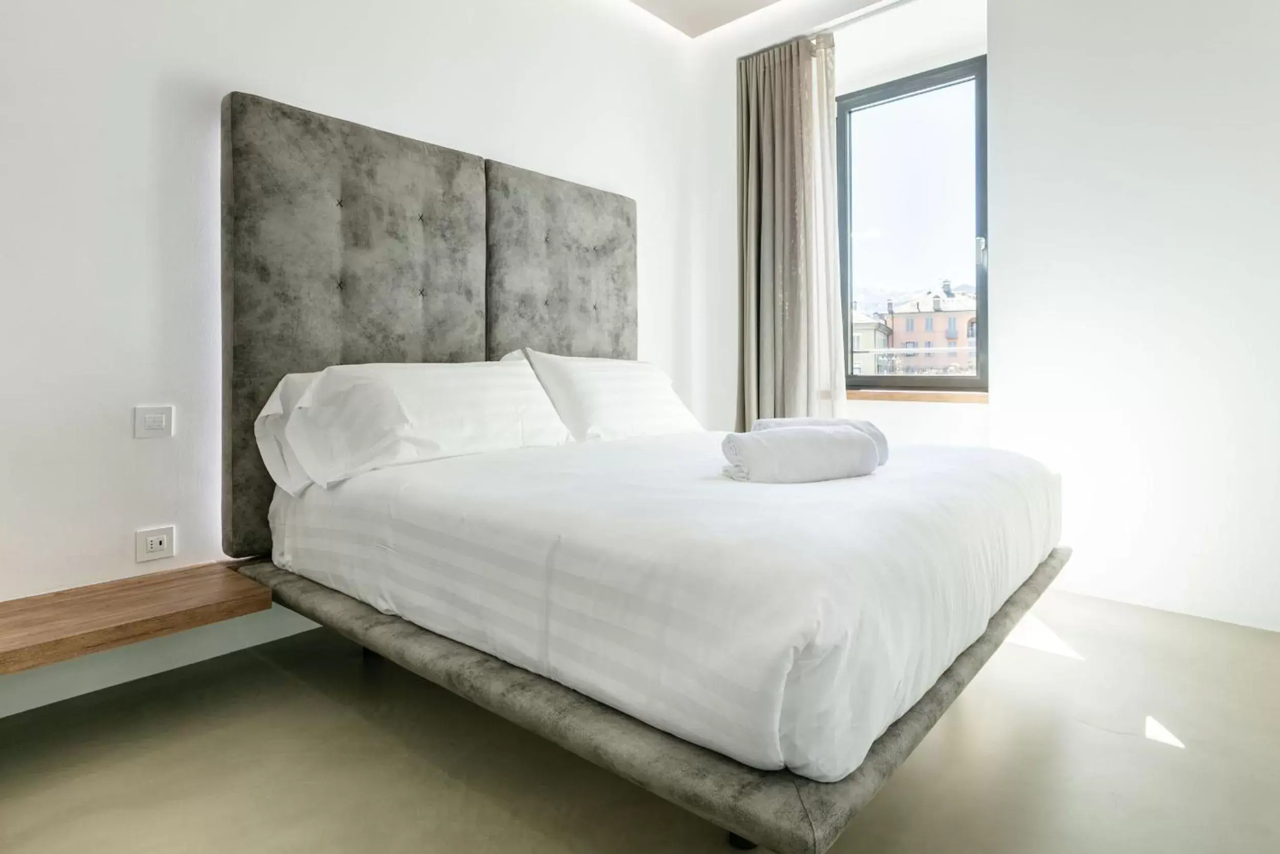 Bed in DOMUS CAVOUR Rooms&Suites