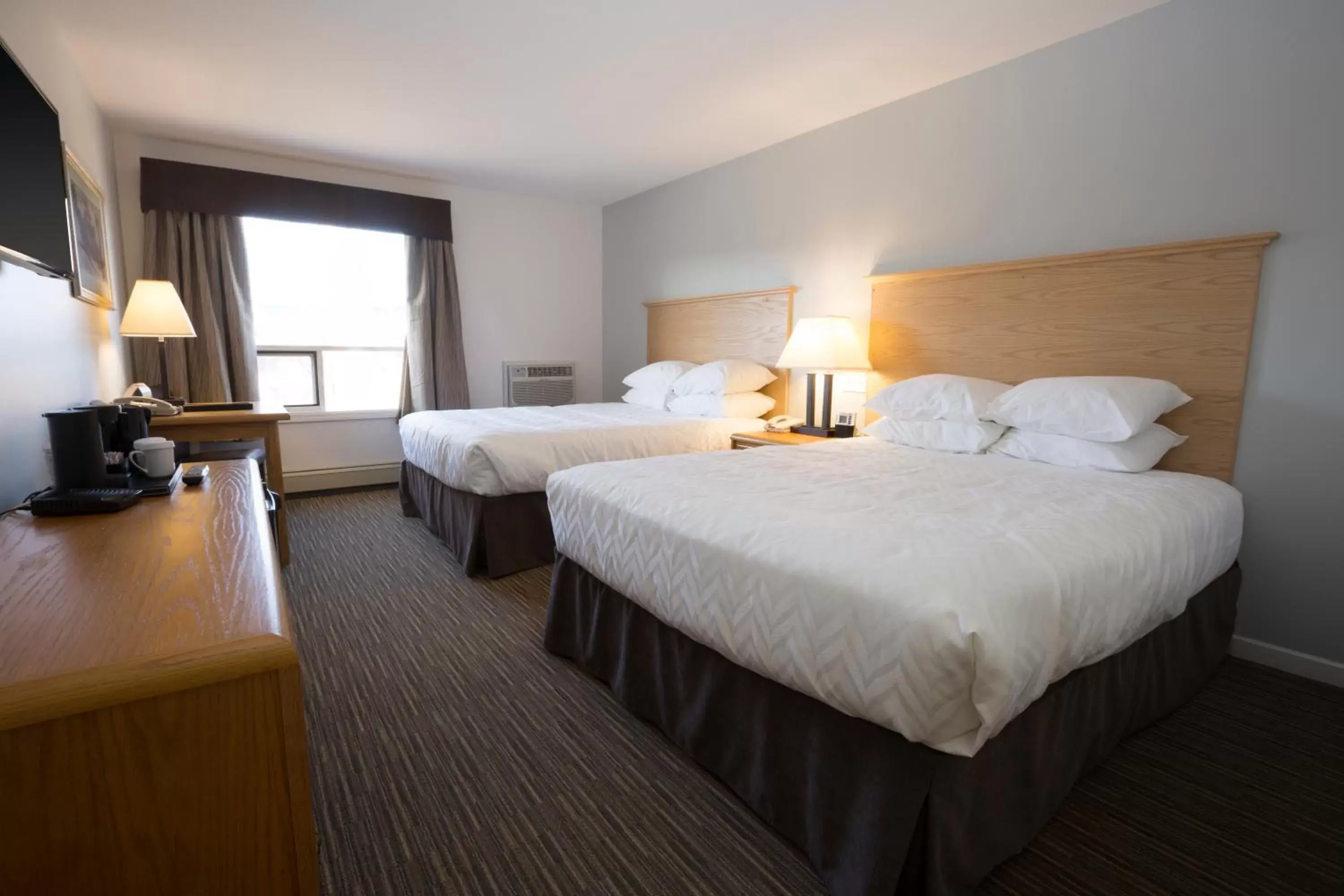 Bed in Tower Inn & Suites