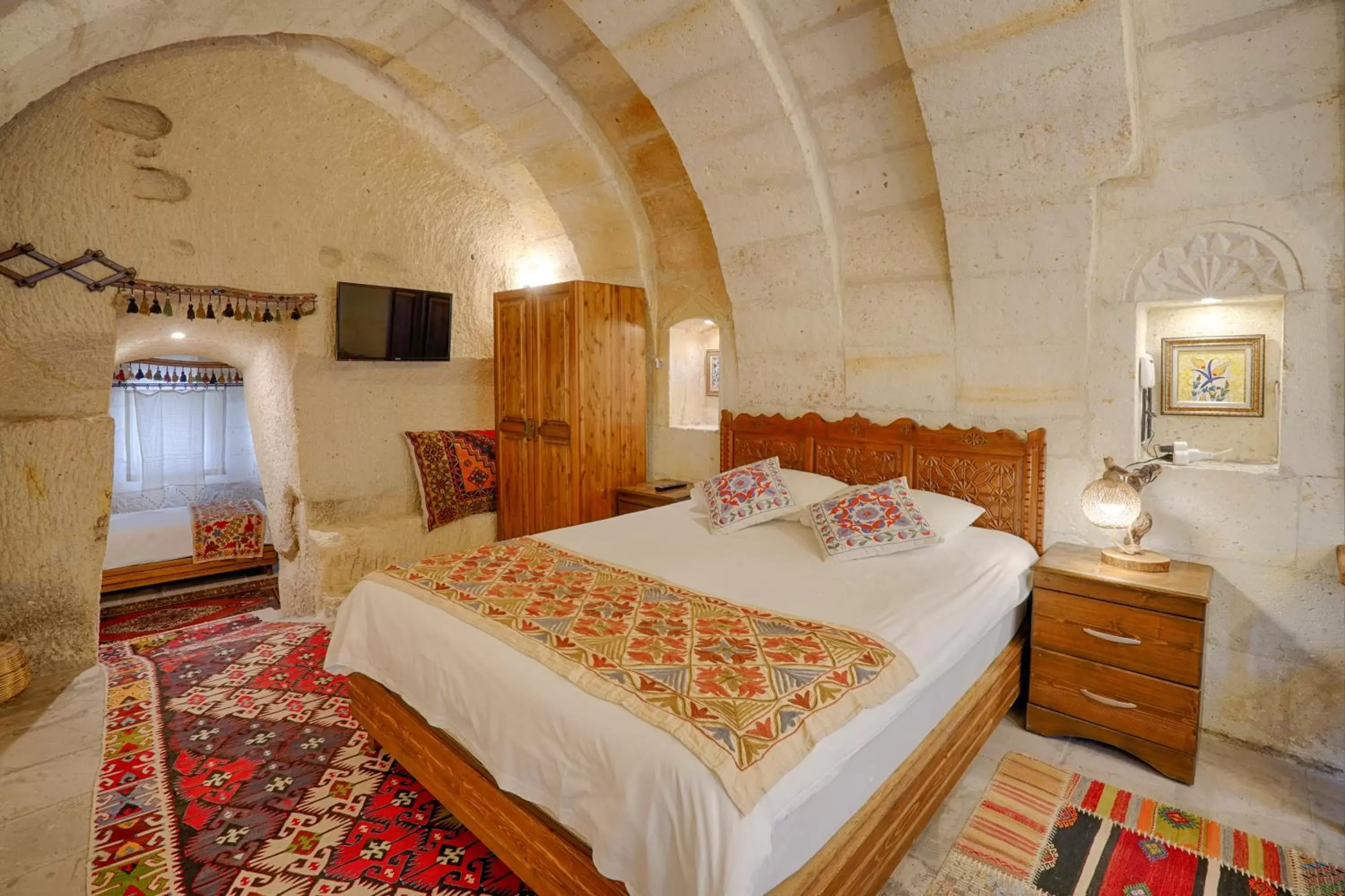 Bed in Tulip Cave Suites