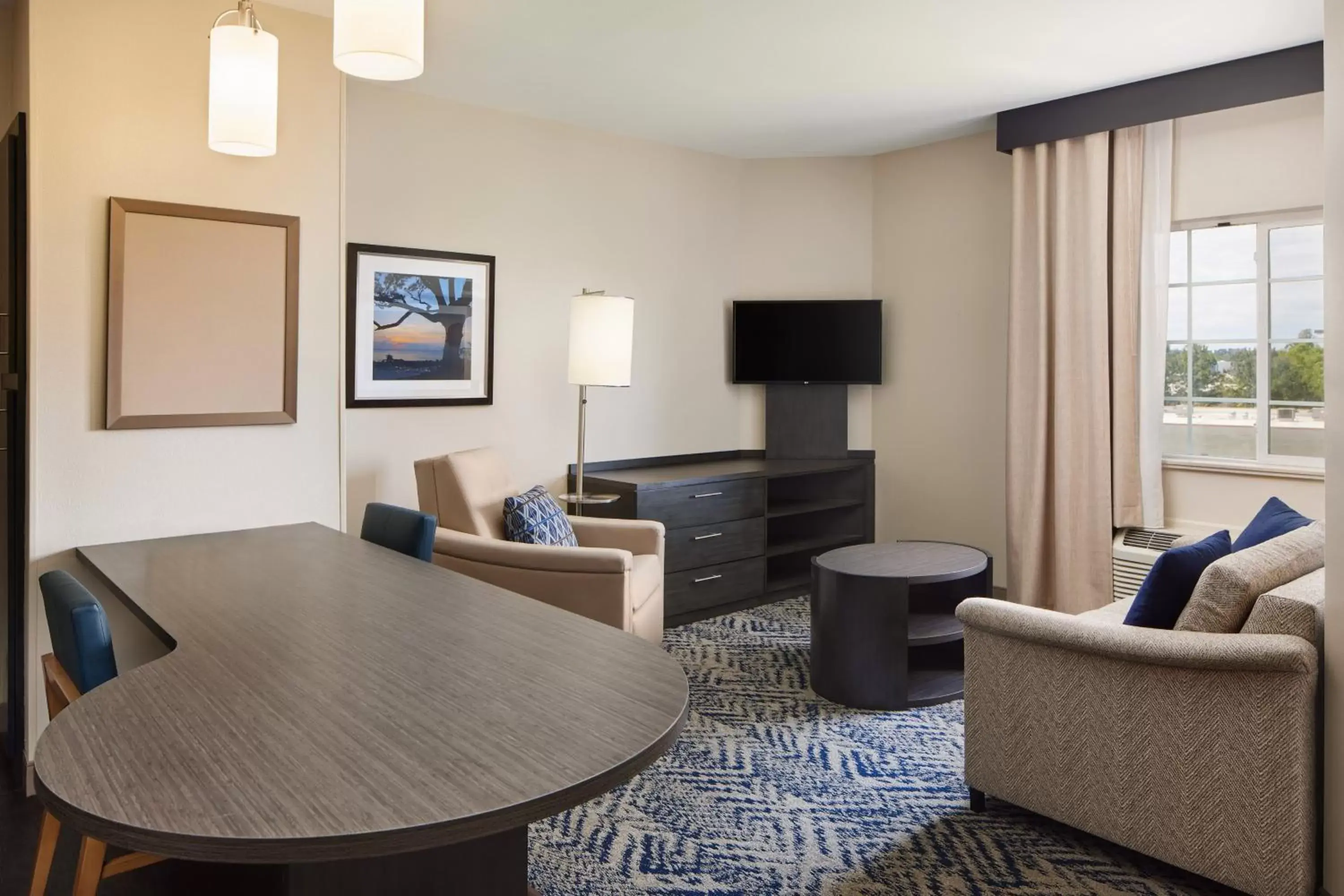 Photo of the whole room, Seating Area in Candlewood Suites I-26 @ Northwoods Mall, an IHG Hotel
