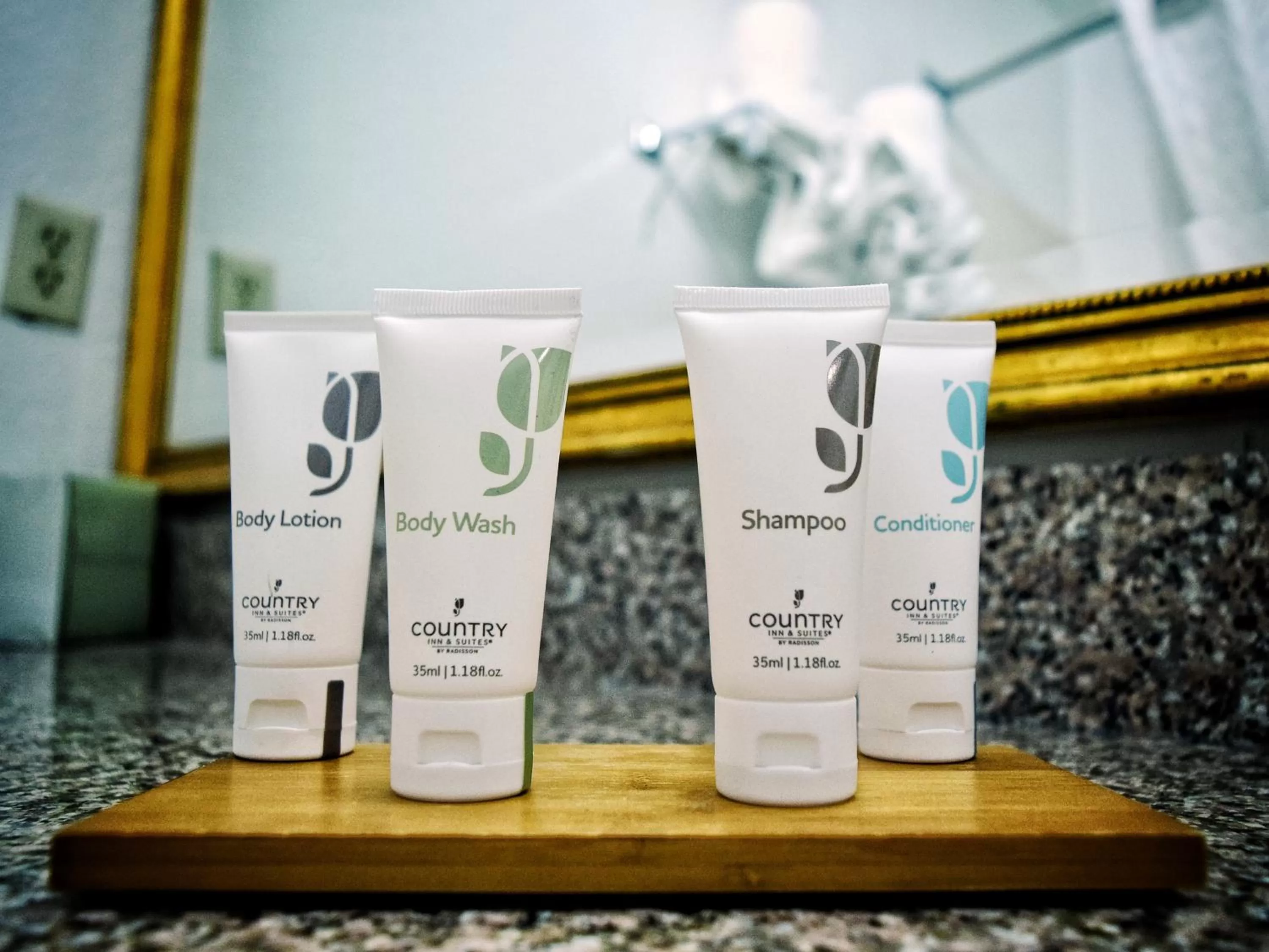 Bathroom in Country Inn & Suites by Radisson, Grand Rapids Airport, MI