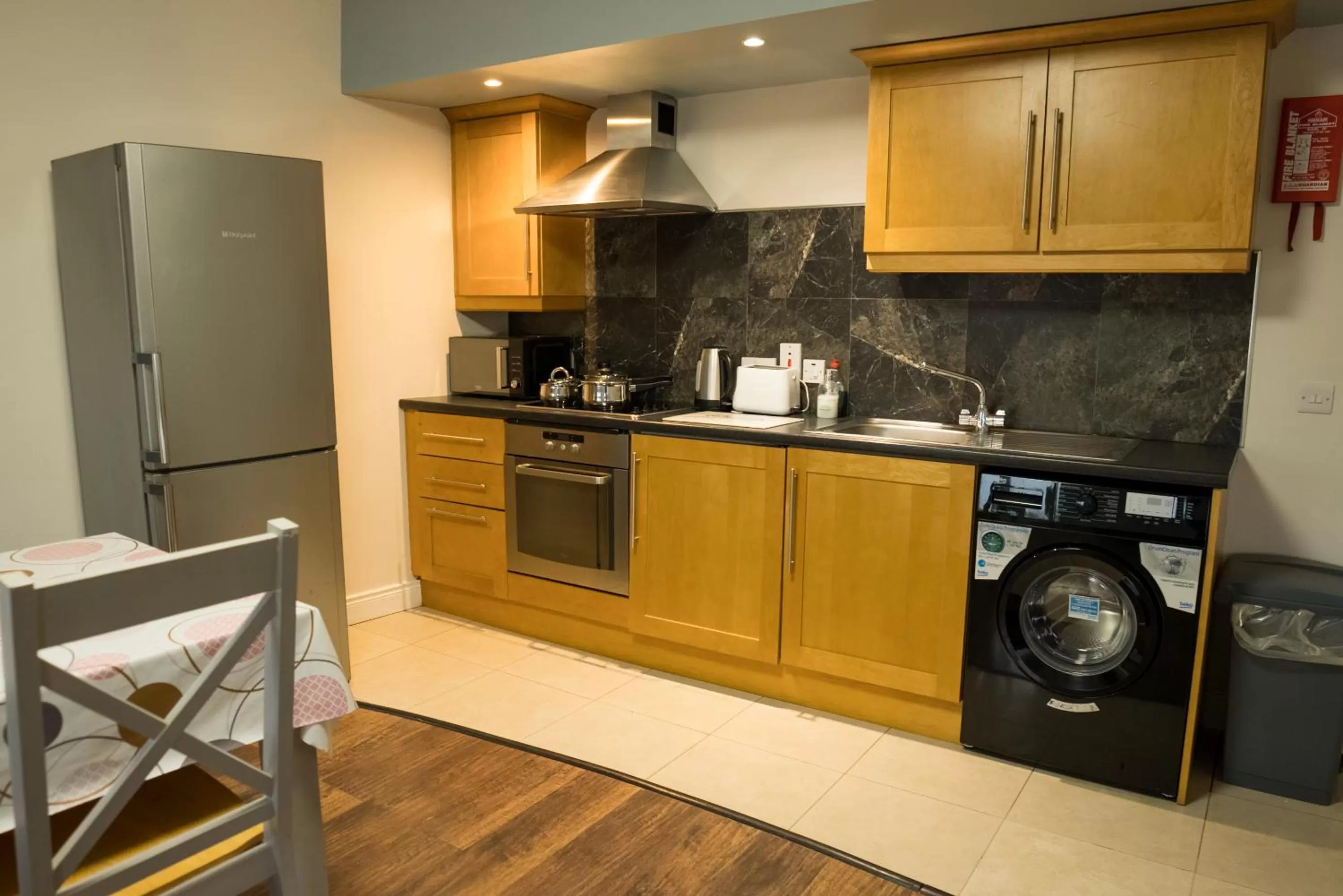 Kitchen or kitchenette in Walsh's Hotel and Apartments