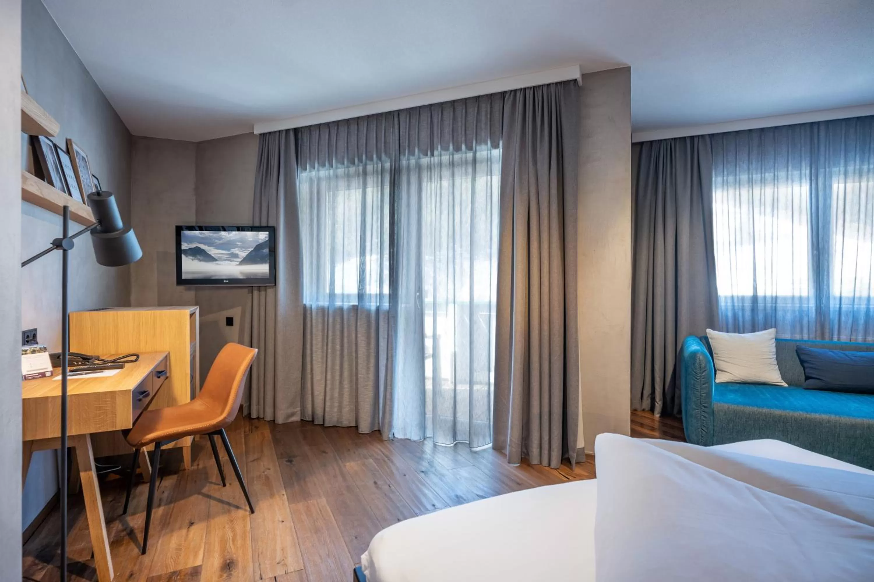 Seating area, Bed in Familienparadies Sporthotel Achensee - FAMILIES ONLY