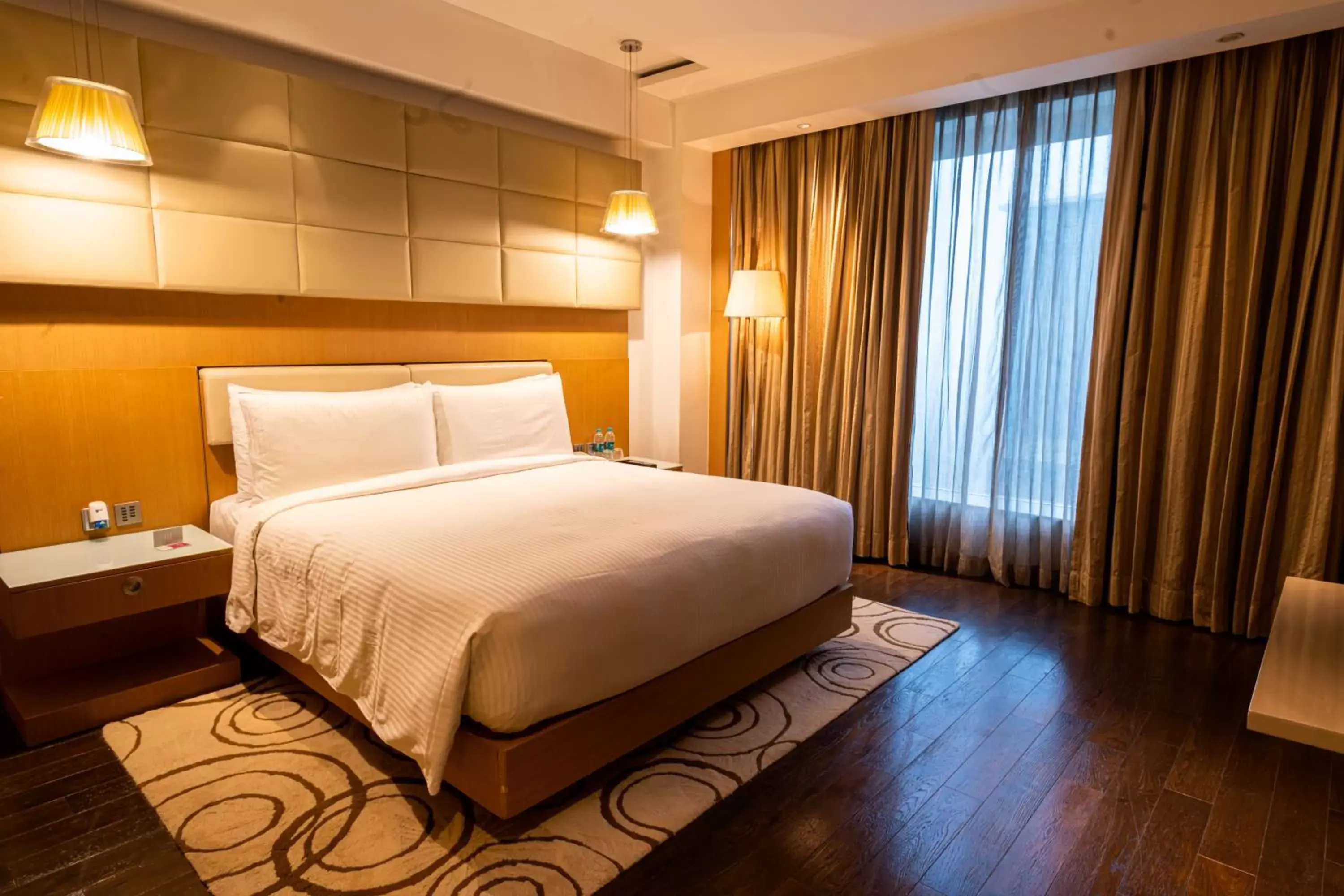 Bed in Crowne Plaza Greater Noida, an IHG Hotel