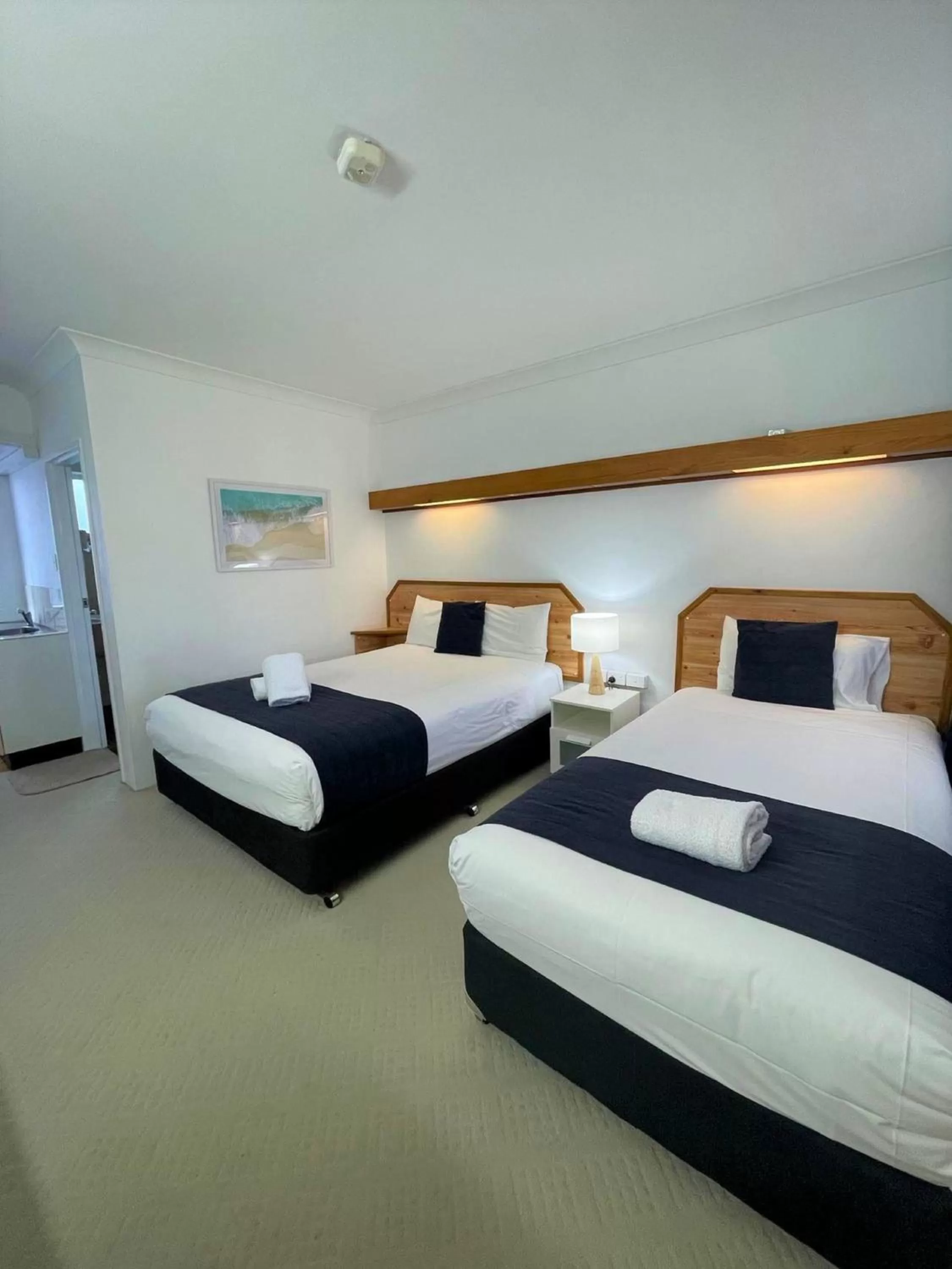 Bed in Forster Motor Inn