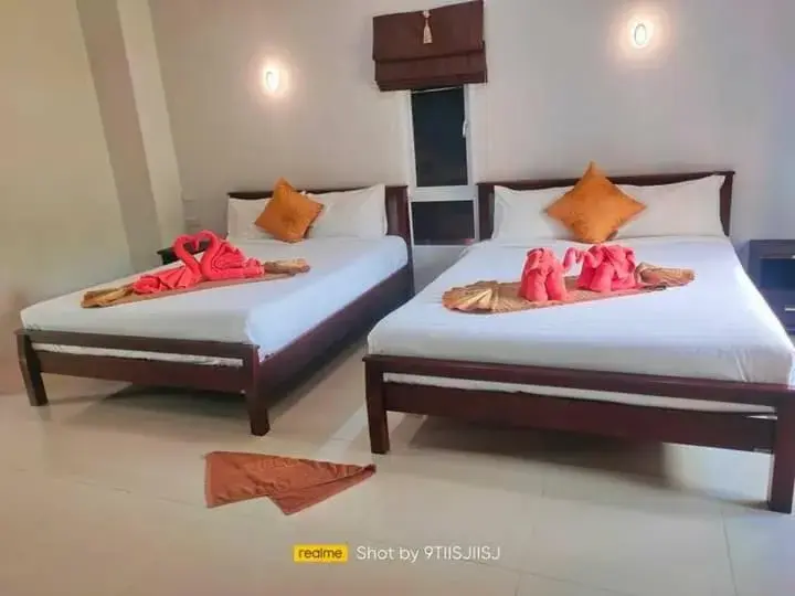 Bed in Tamarind Twin Resort