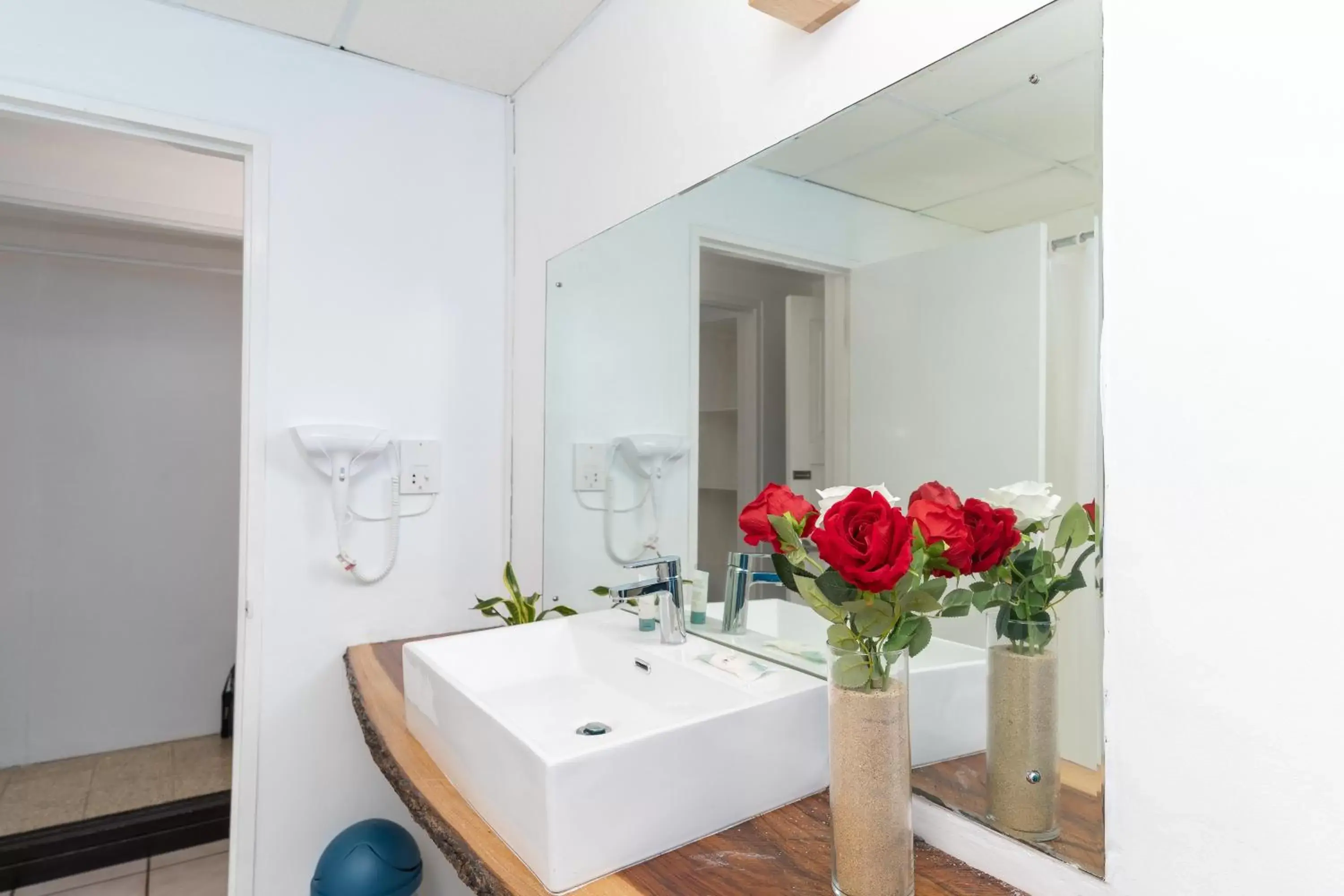 Bathroom in Sand and Tan Beach Hotel