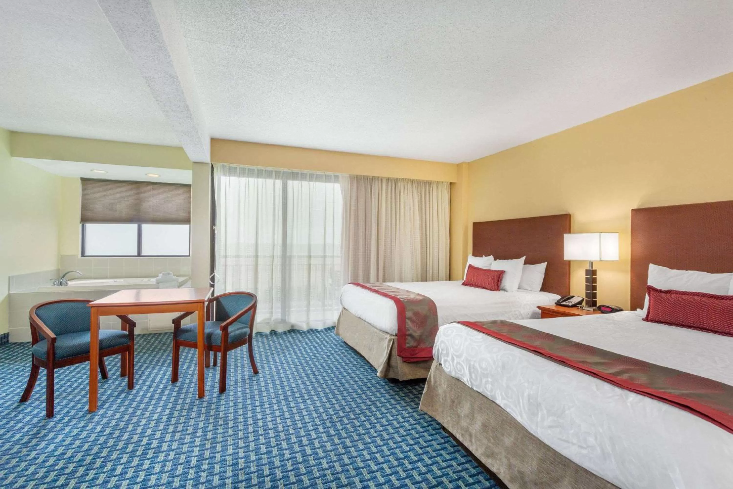Photo of the whole room, Bed in Ramada Plaza by Wyndham Virginia Beach Oceanfront