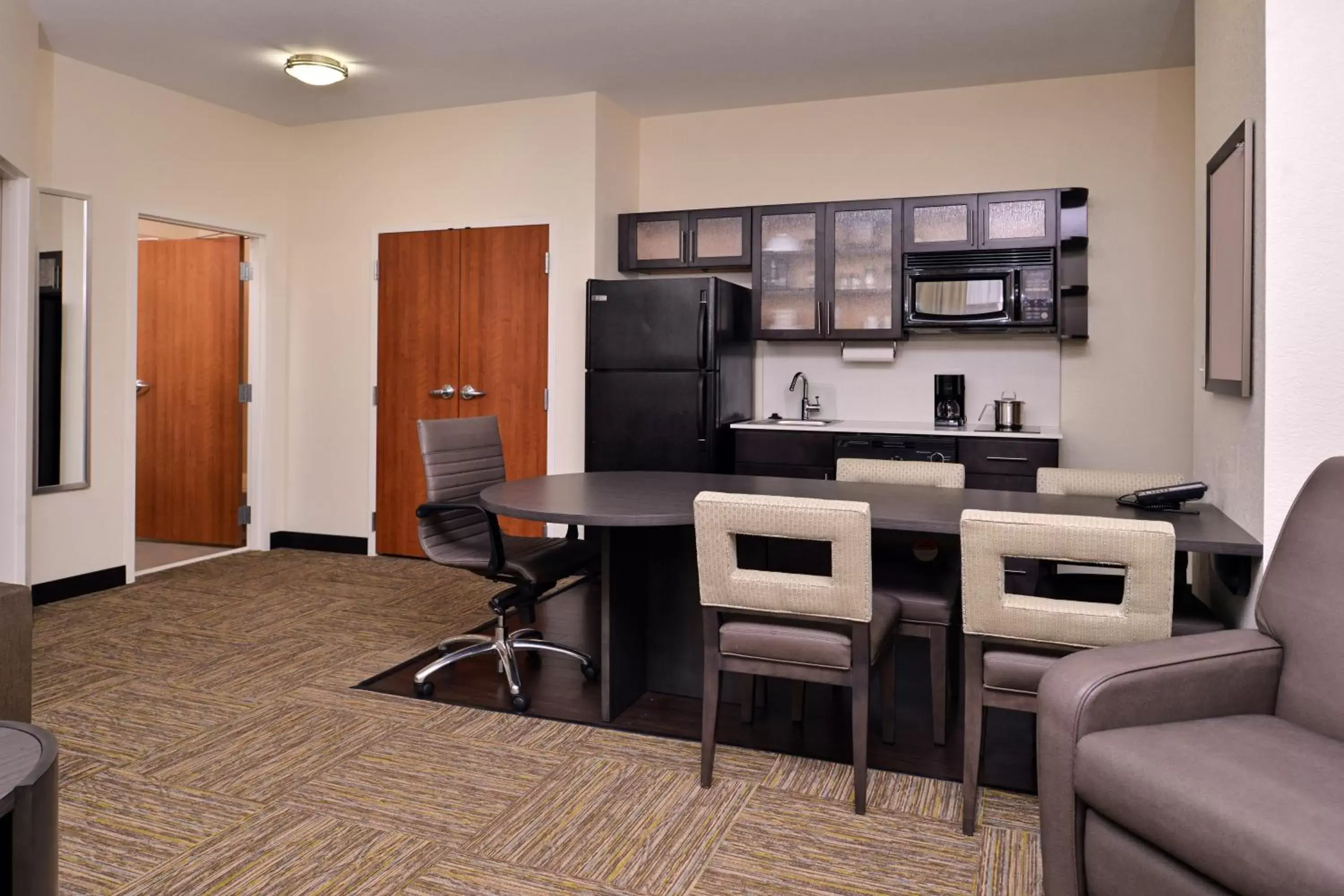 Photo of the whole room, Seating Area in Candlewood Suites Terre Haute, an IHG Hotel
