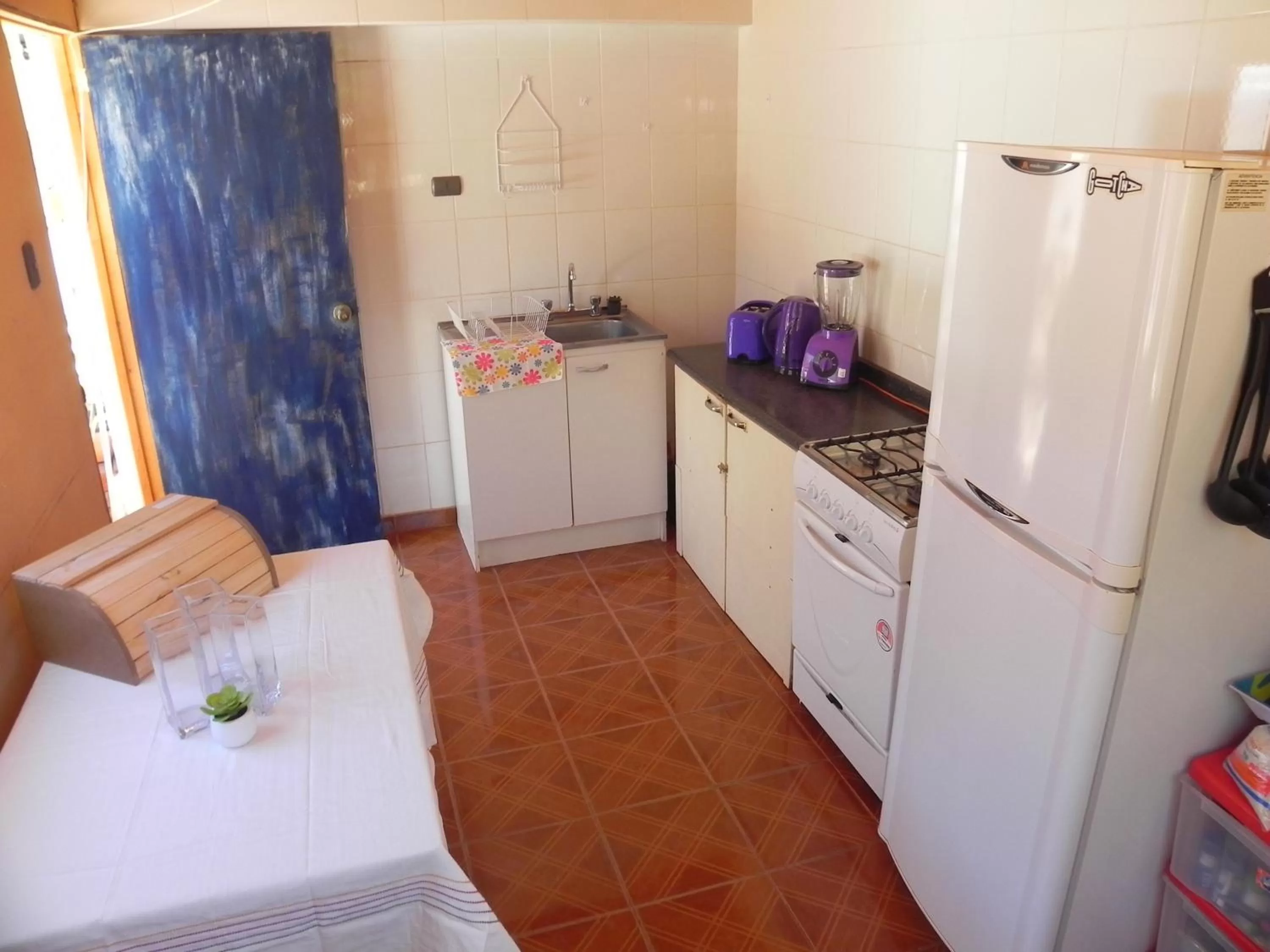 Kitchen or kitchenette in Hostal Siete Colores