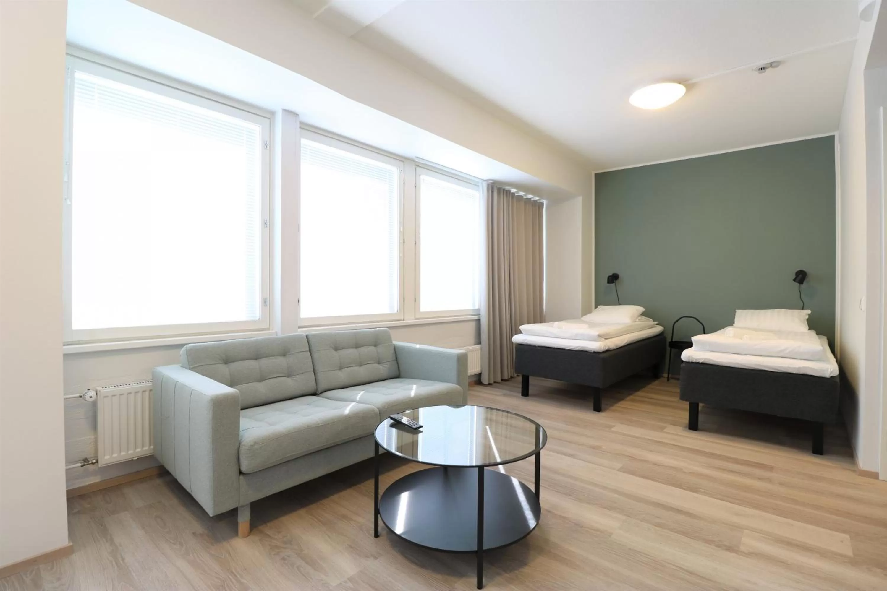 Living room, Bed in Forenom Aparthotel Helsinki Herttoniemi