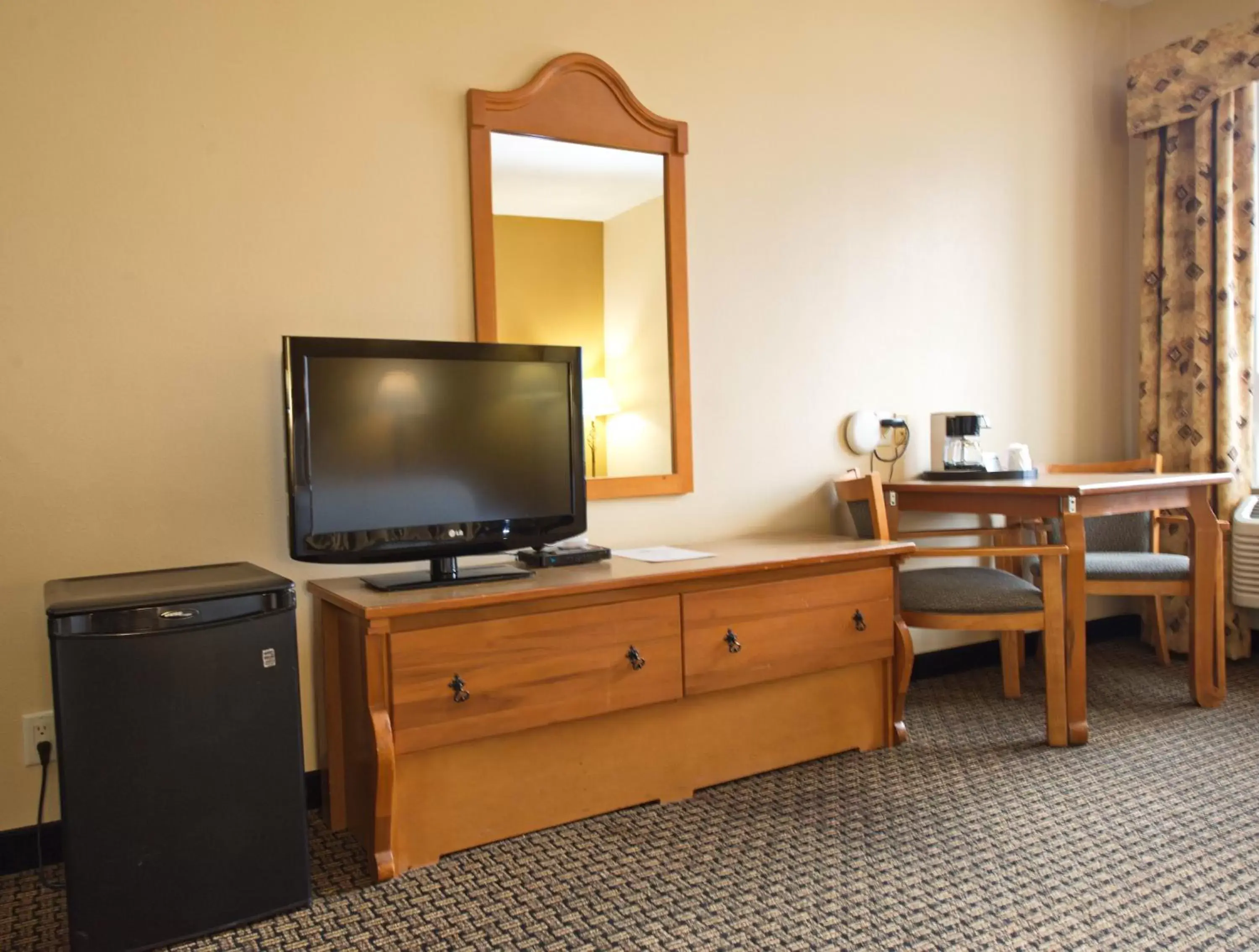 Photo of the whole room, TV/Entertainment Center in The Tombstone Grand Hotel