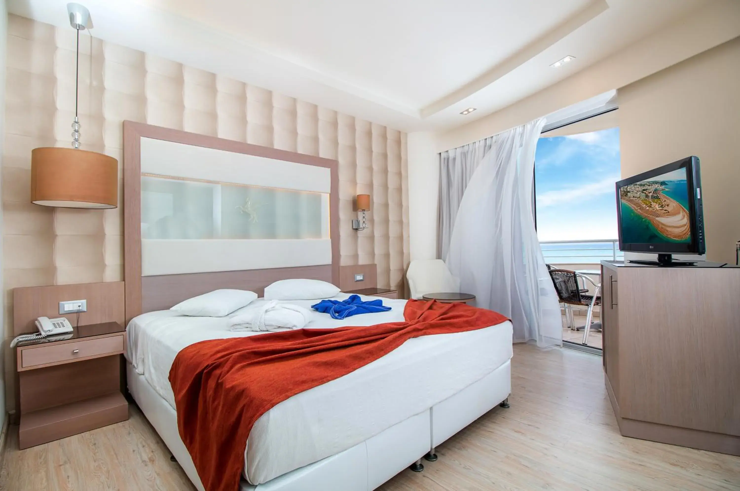 Bedroom in Pegasos Deluxe Beach Hotel