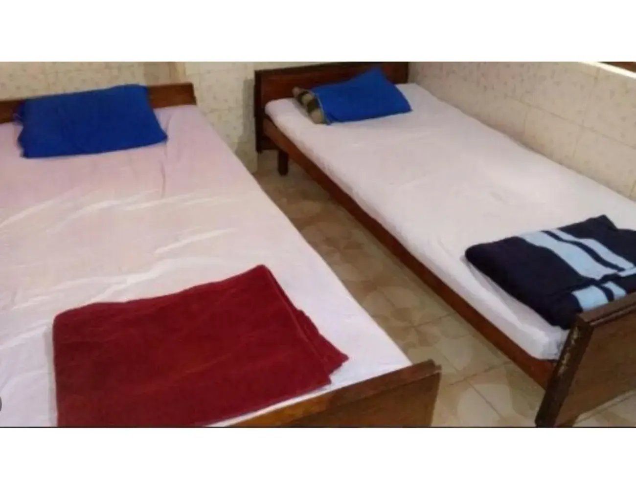 Bedroom, Bed in Goroomgo Central Guest House Agartala