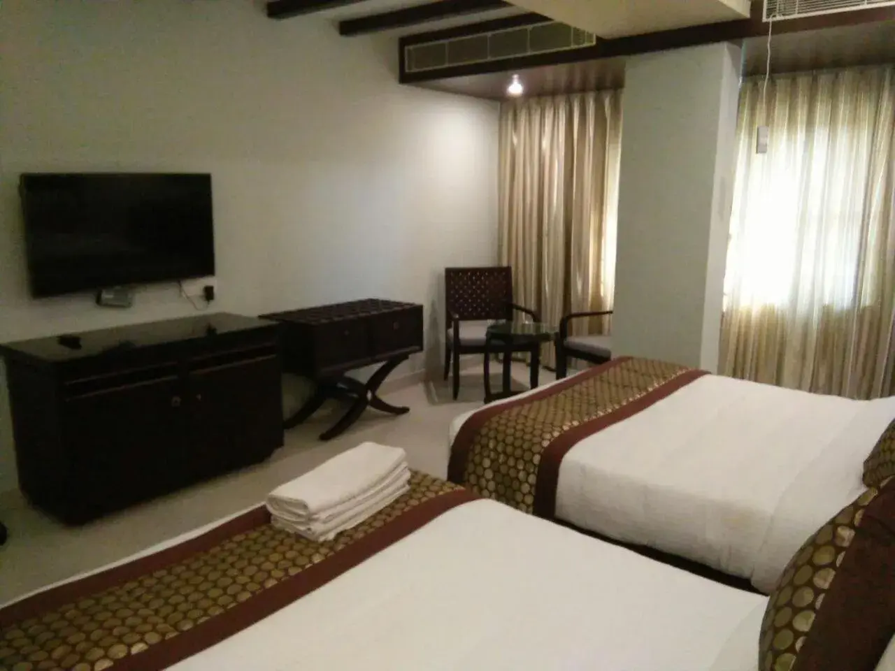 Photo of the whole room, Bed in Pride Ananya Resort Puri