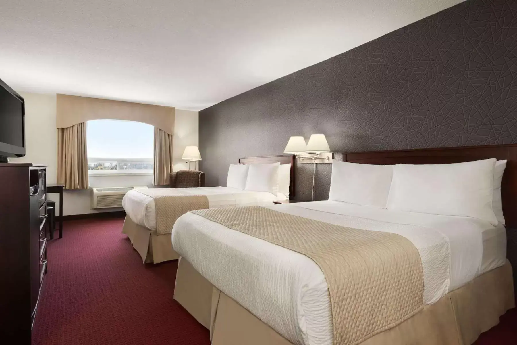 Photo of the whole room, Bed in Days Inn & Suites by Wyndham Brandon