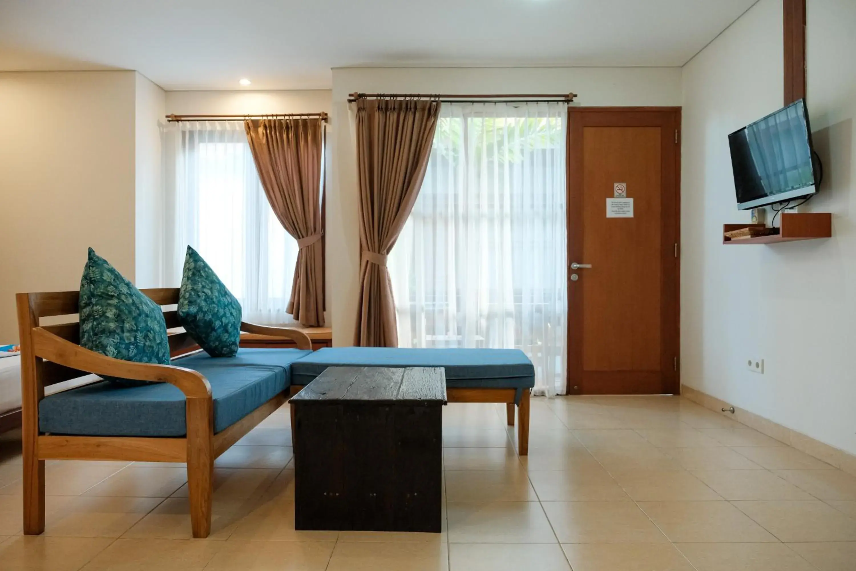 Communal lounge/ TV room, Seating Area in Semarandana Bedrooms and Pool