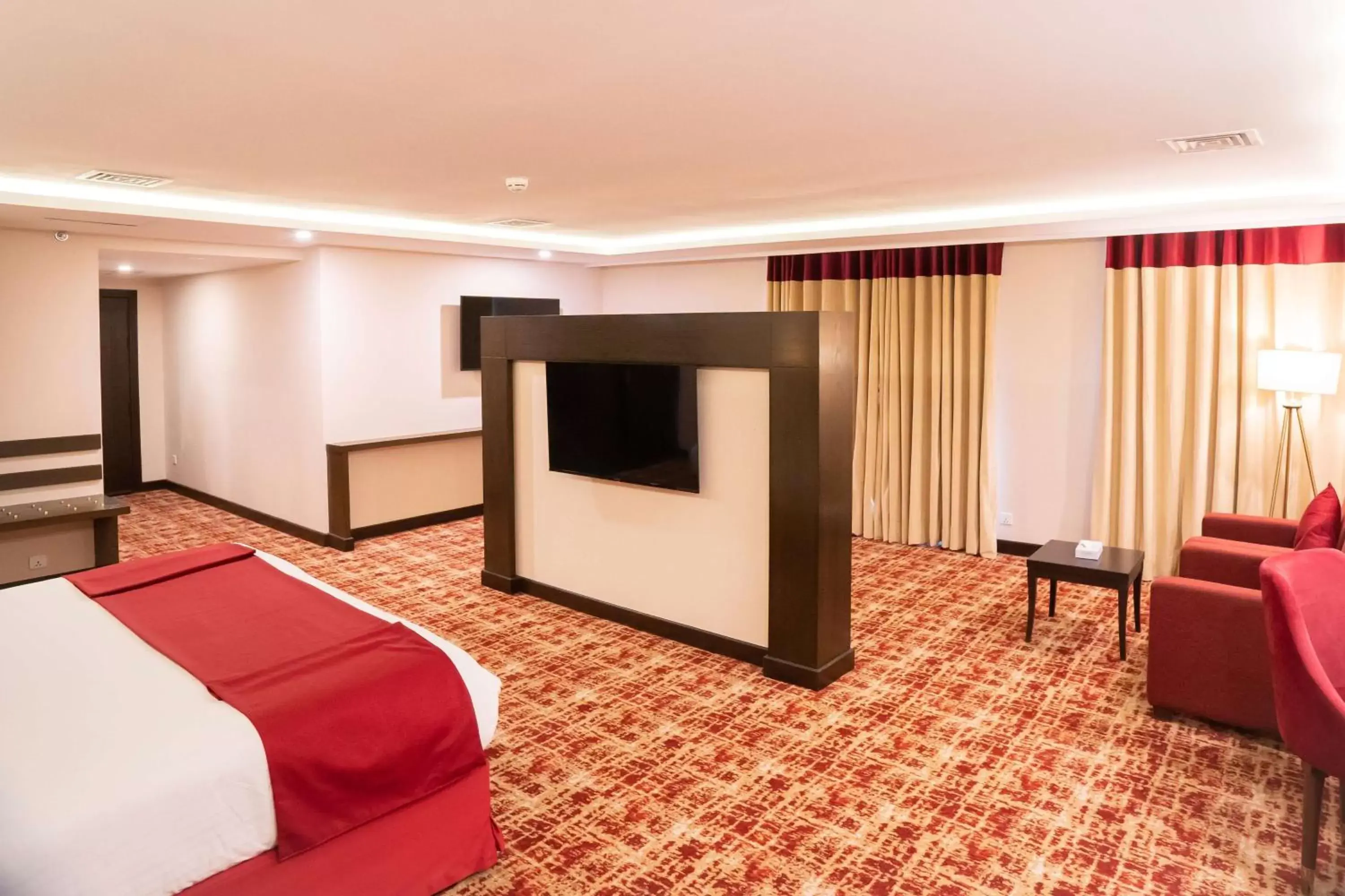 Bed, TV/Entertainment Center in Ramada by Wyndham Murree Lower Topa Resort