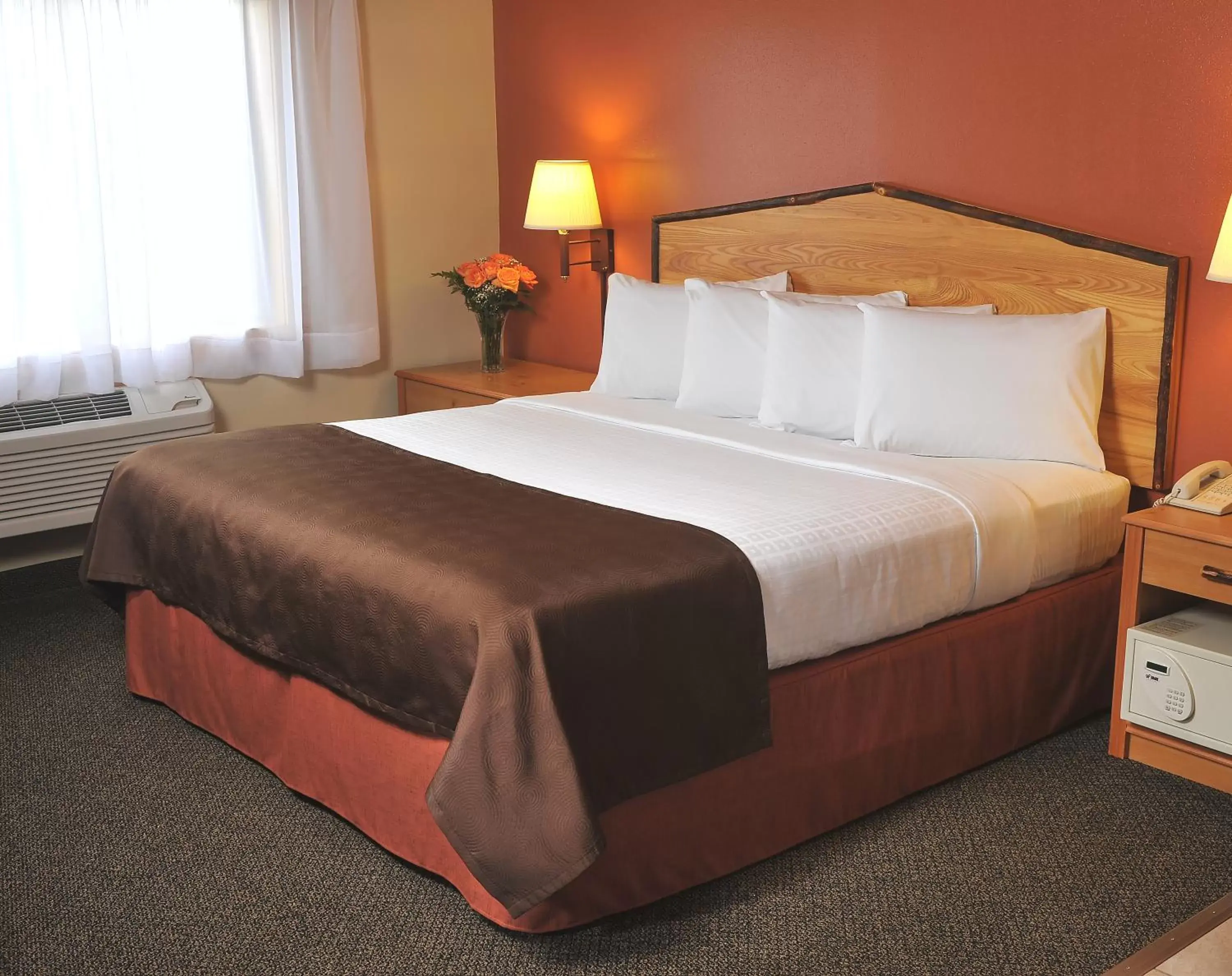 Bed in AmericInn by Wyndham Oswego