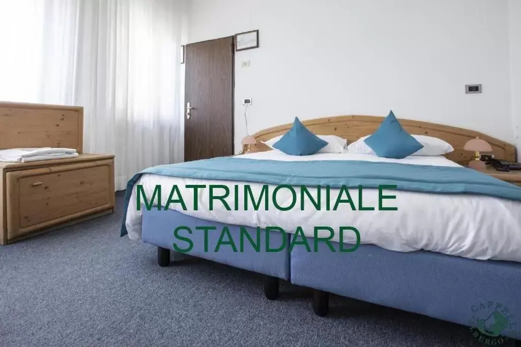 Bed in Albergo Cappello e Cadore