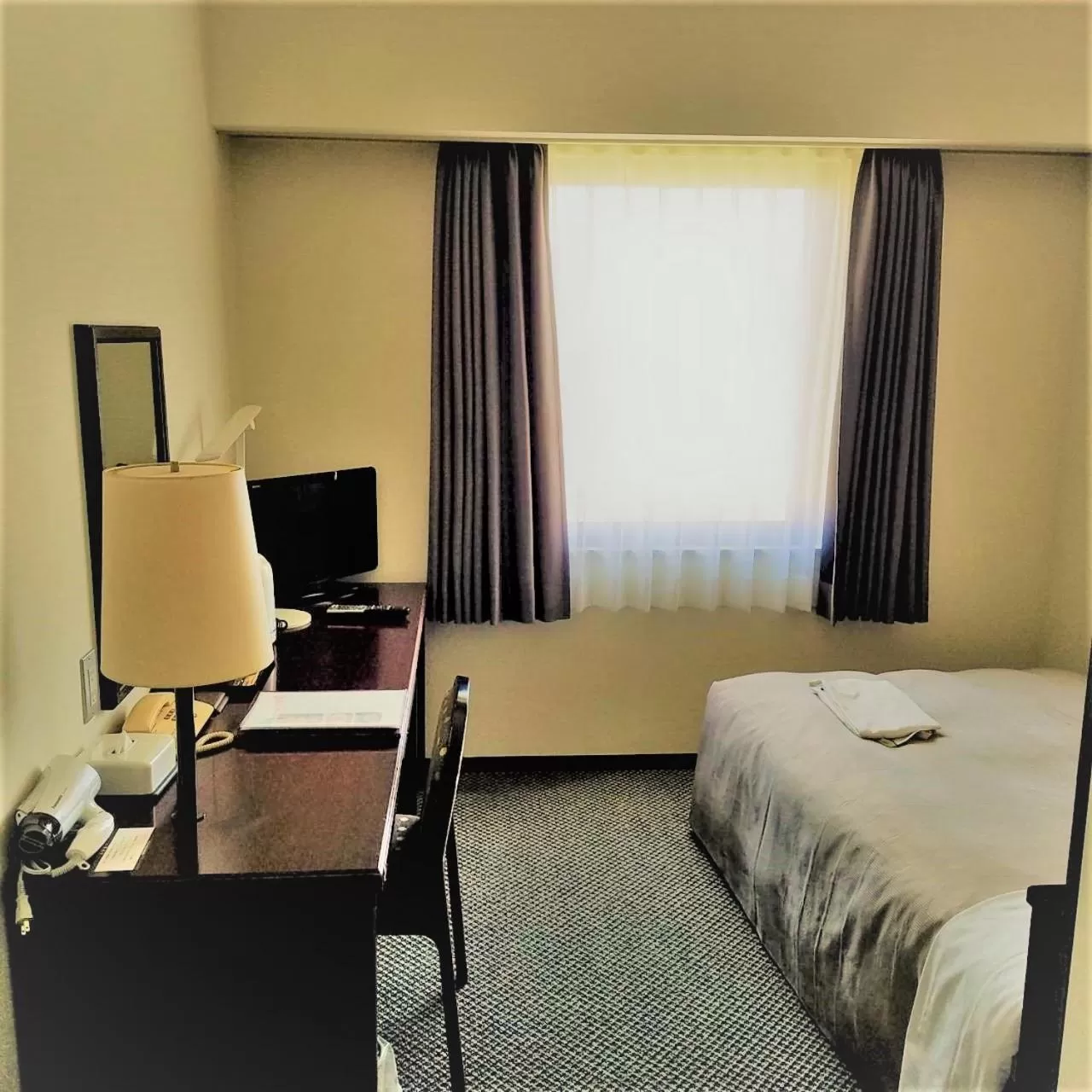 Bed in Ishinomaki Grand Hotel