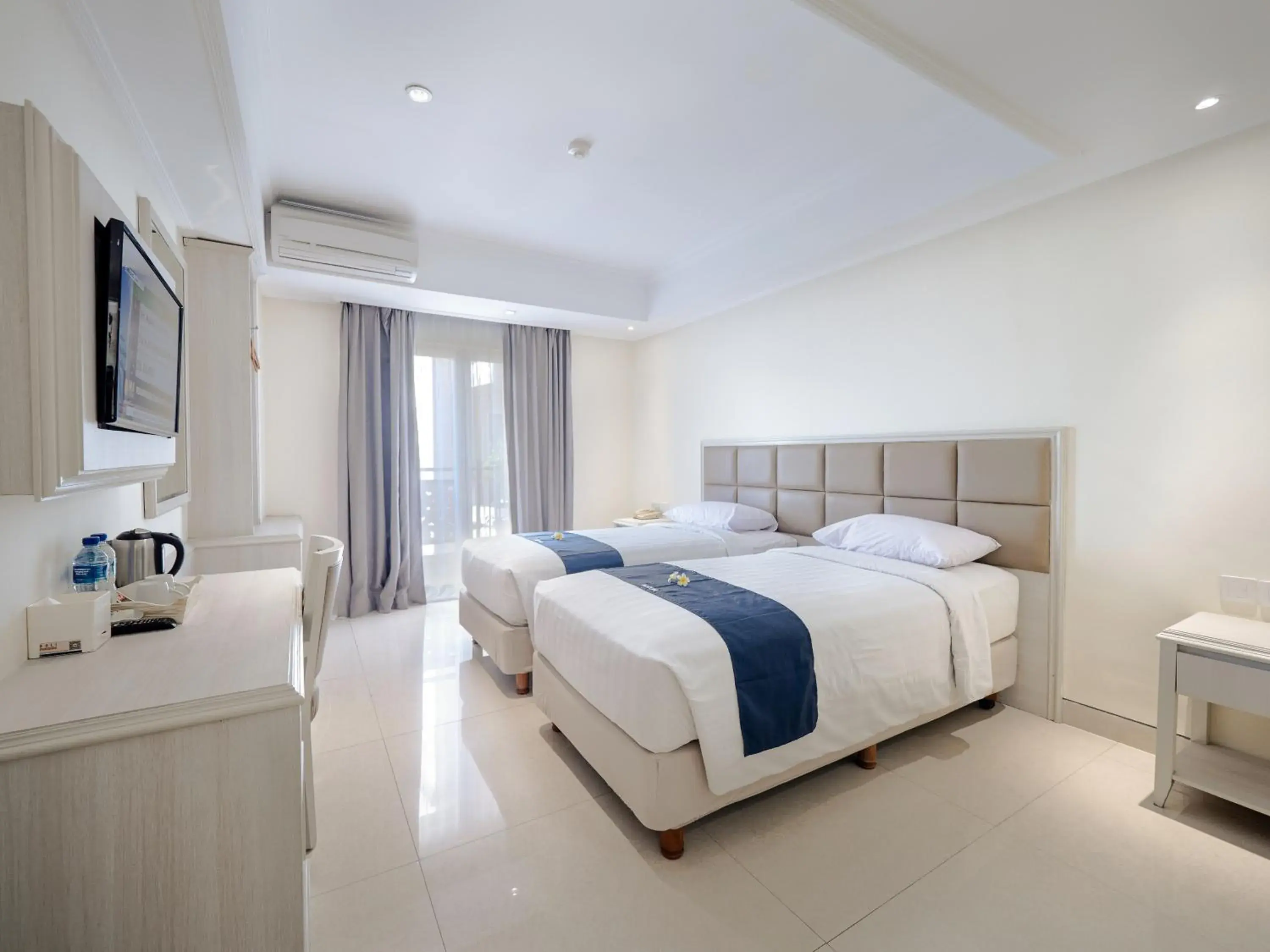 Bed in Alron Hotel Kuta Powered by Archipelago