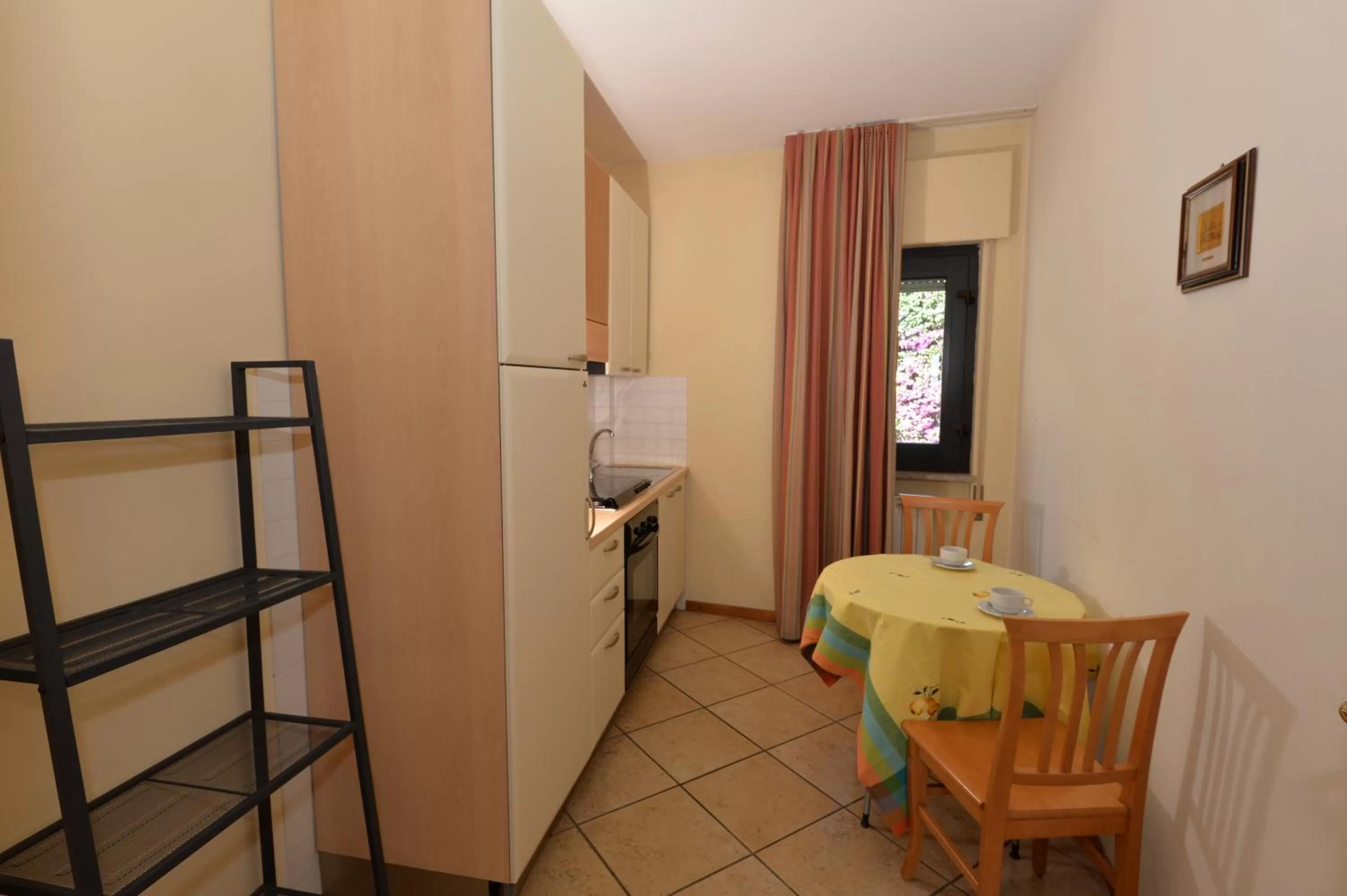 Kitchen or kitchenette, Bed in Miramare Residence