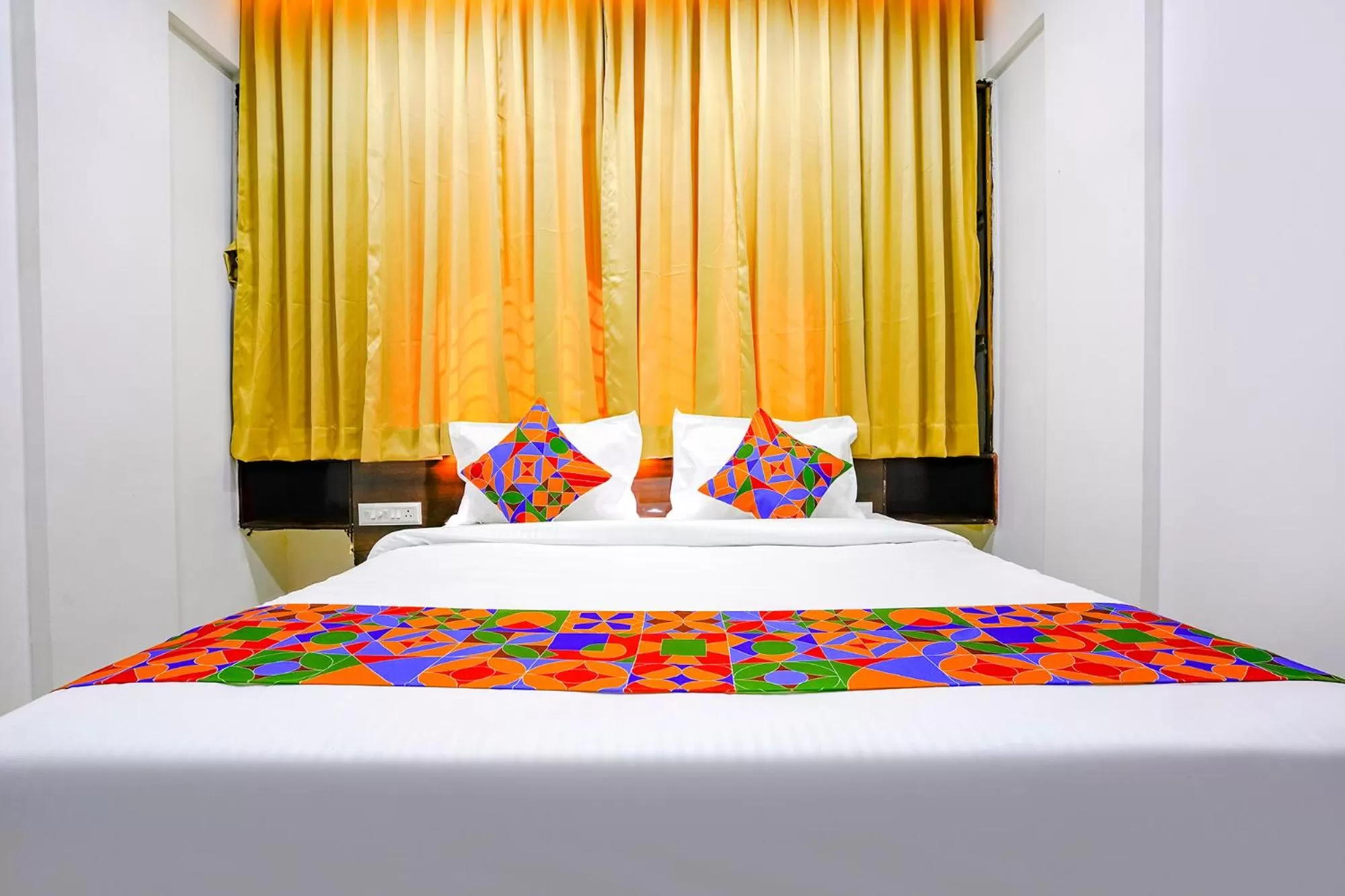 Bed in FabHotel Woods Regency