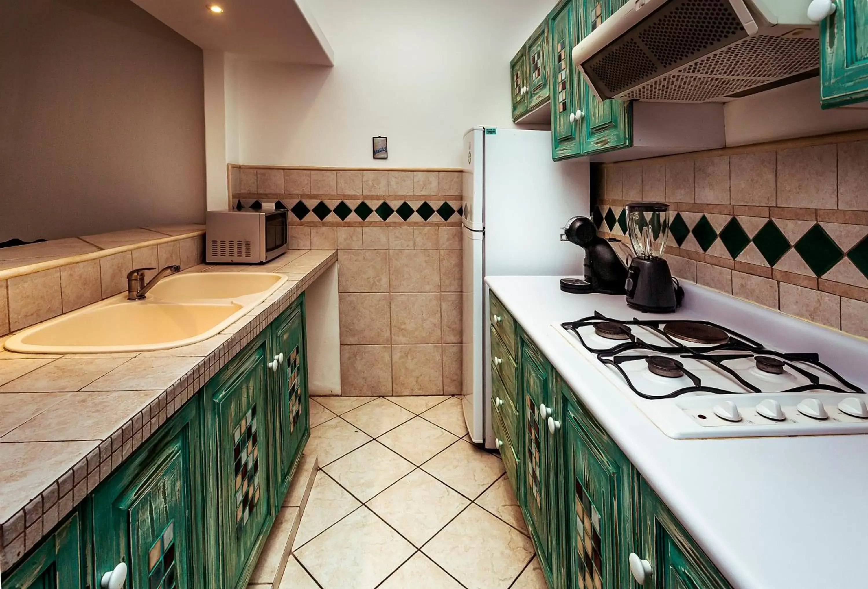 Kitchen/Kitchenette in Fabiola Condo Hotel